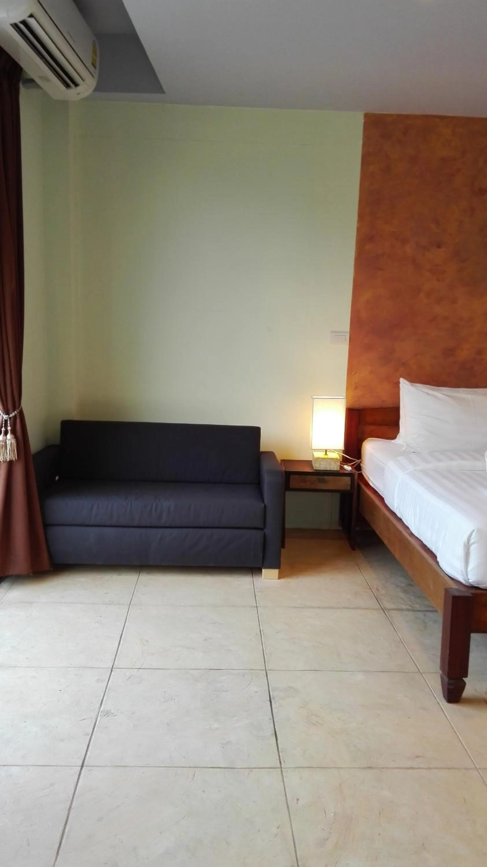 Bed in Arcadia Maephim Serviced Apartments