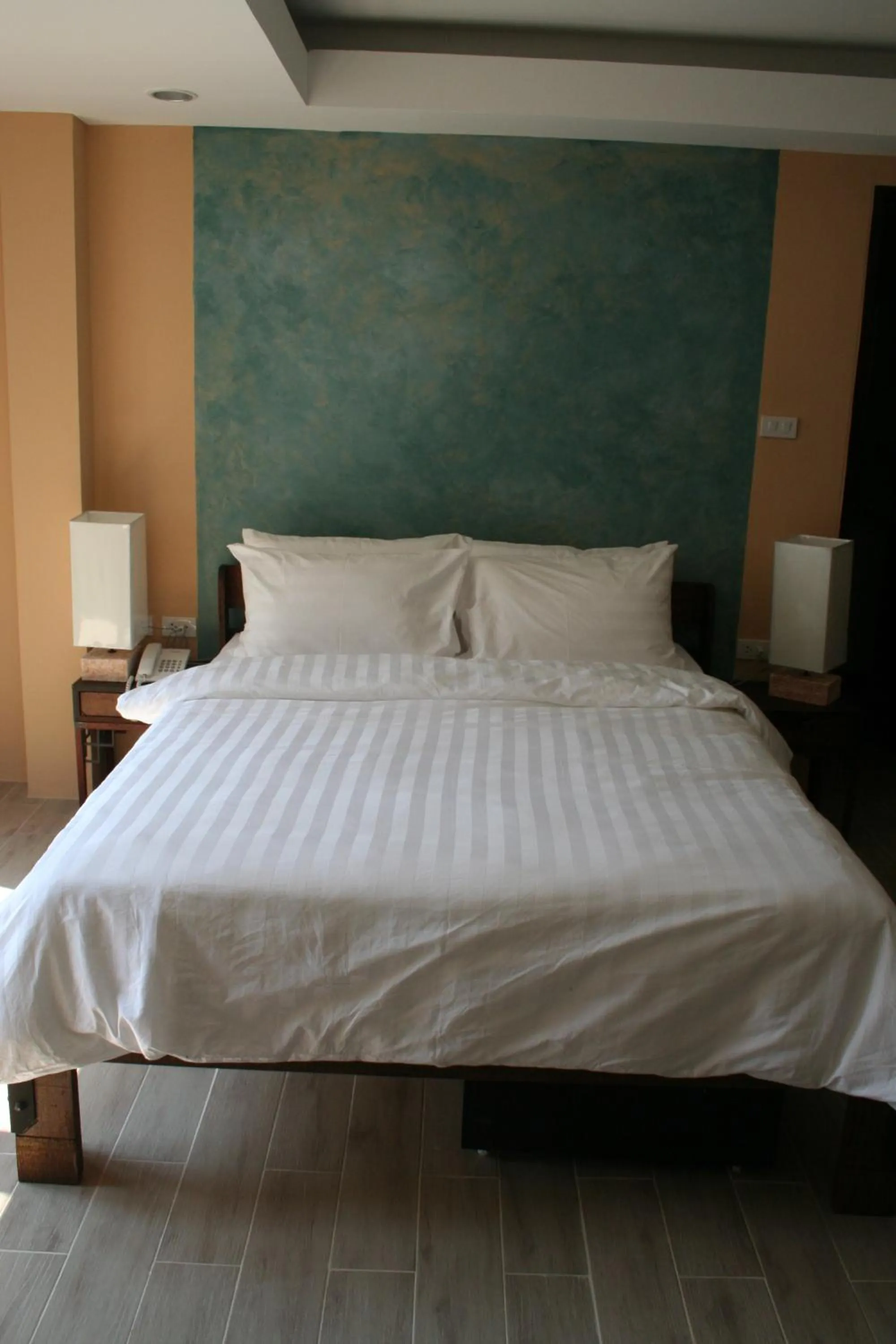 Bed in Arcadia Maephim Serviced Apartments