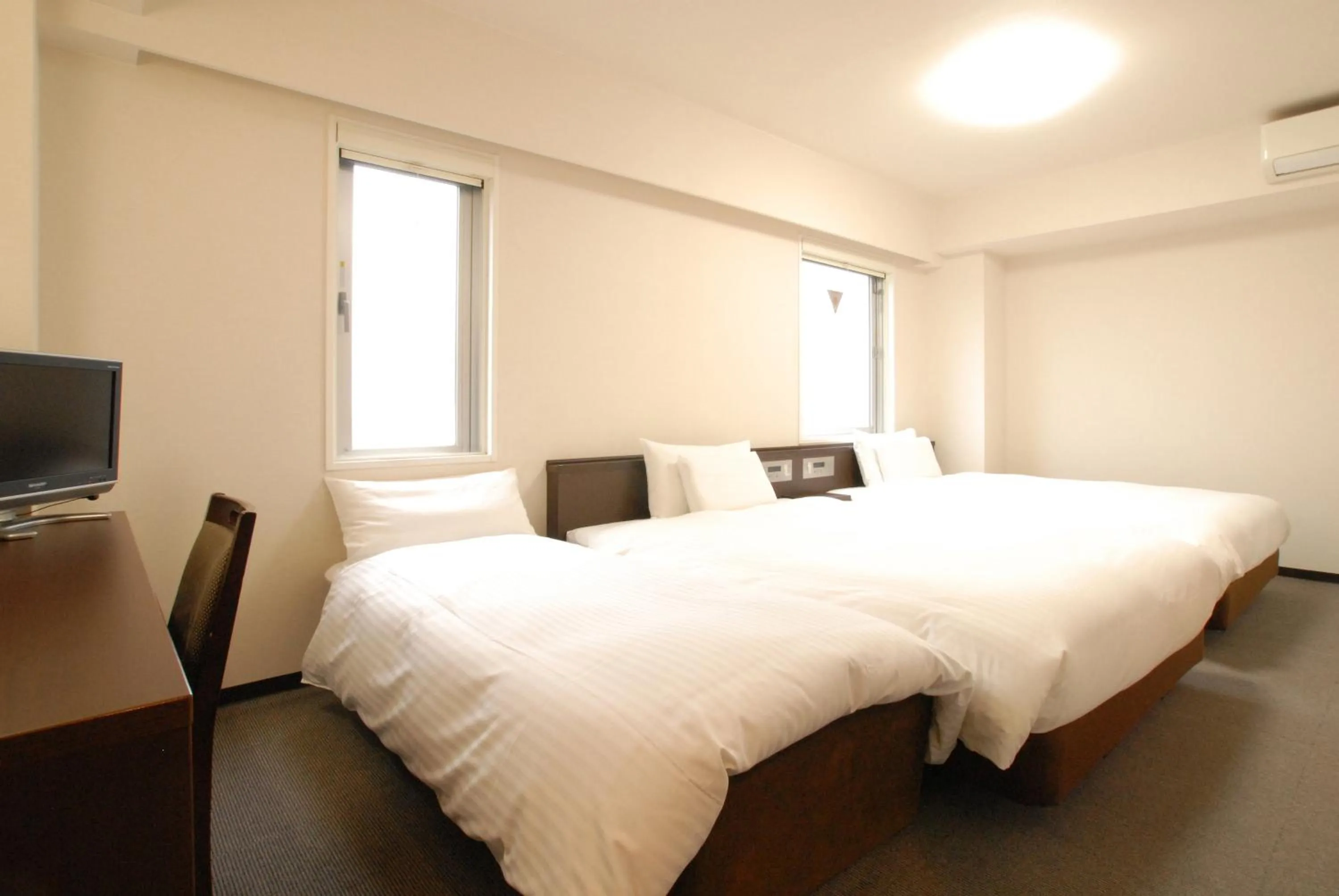 Bed in AB Hotel Toyota Motomachi