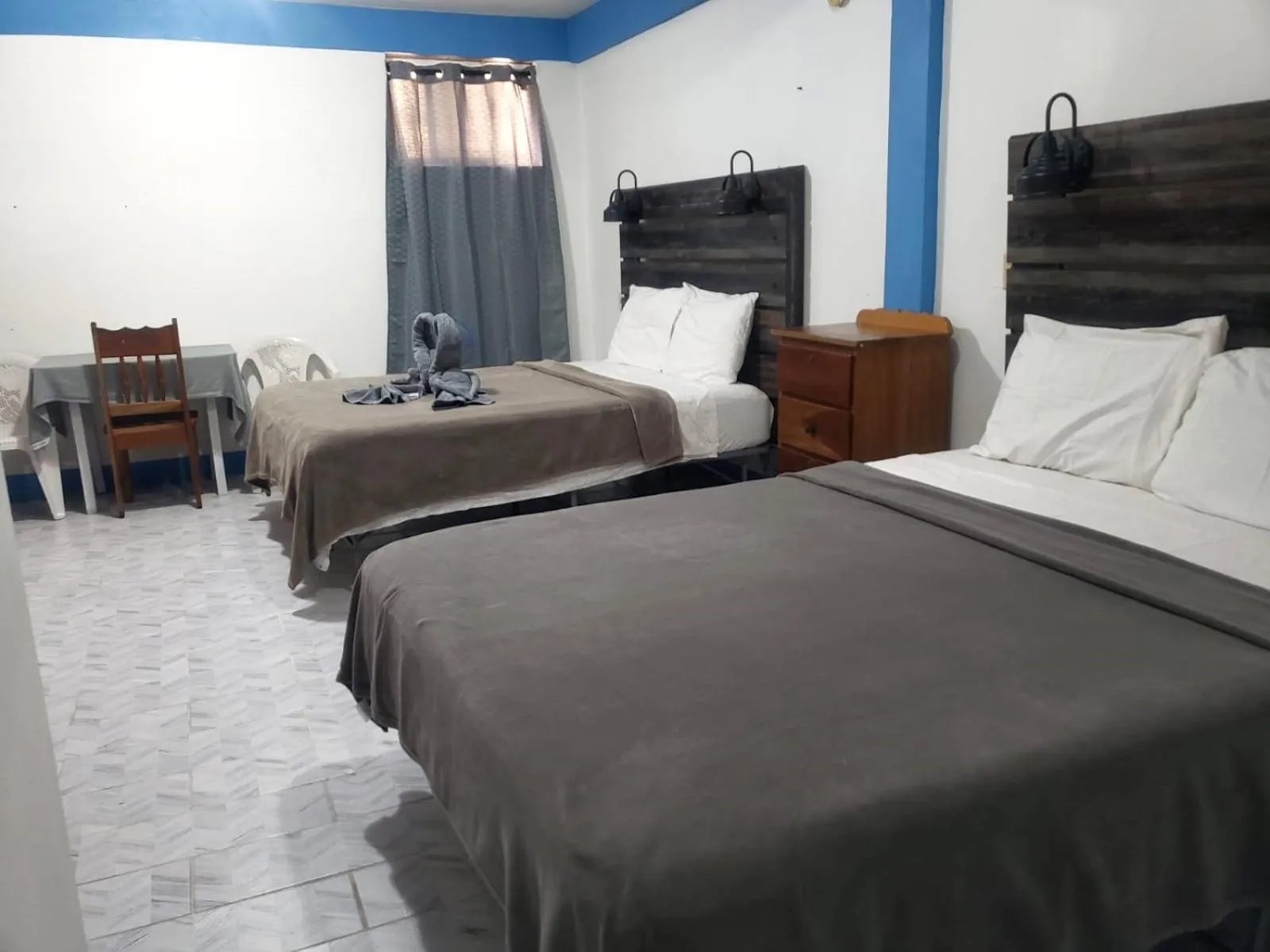 Bed in Beach Side Condos Caye Caulker by CCVH