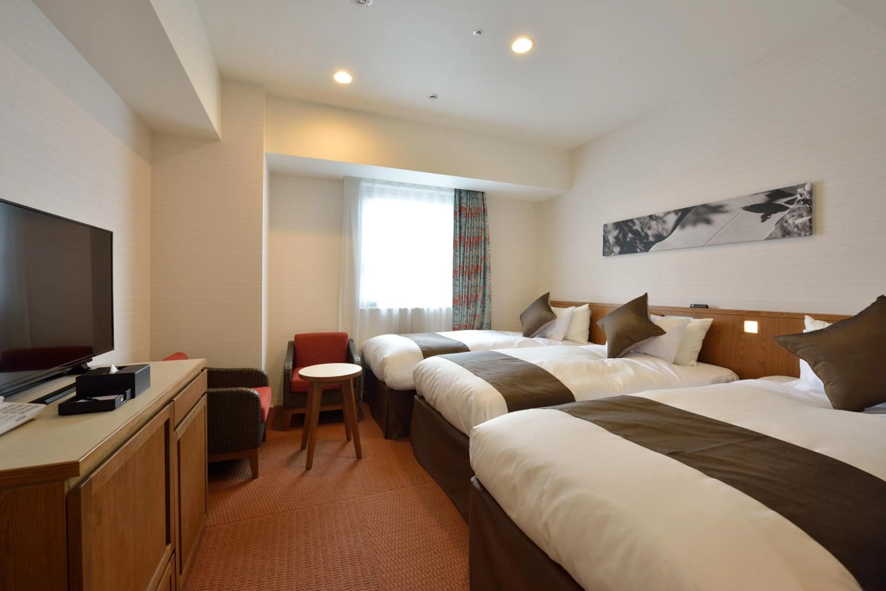 Bed in Hotel Gracery Naha