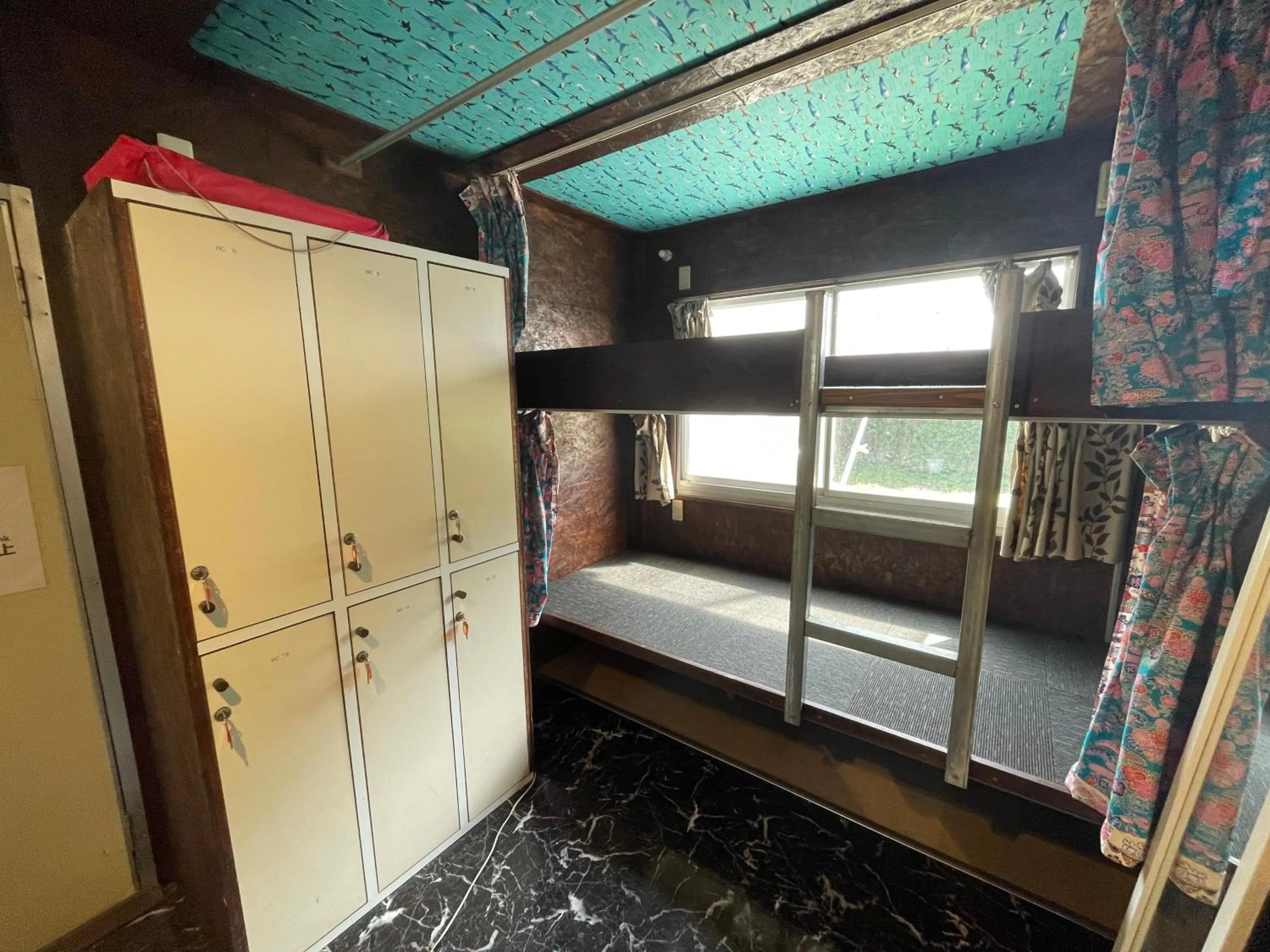 Bed in Sesoko Island Guest House Kafuu Village