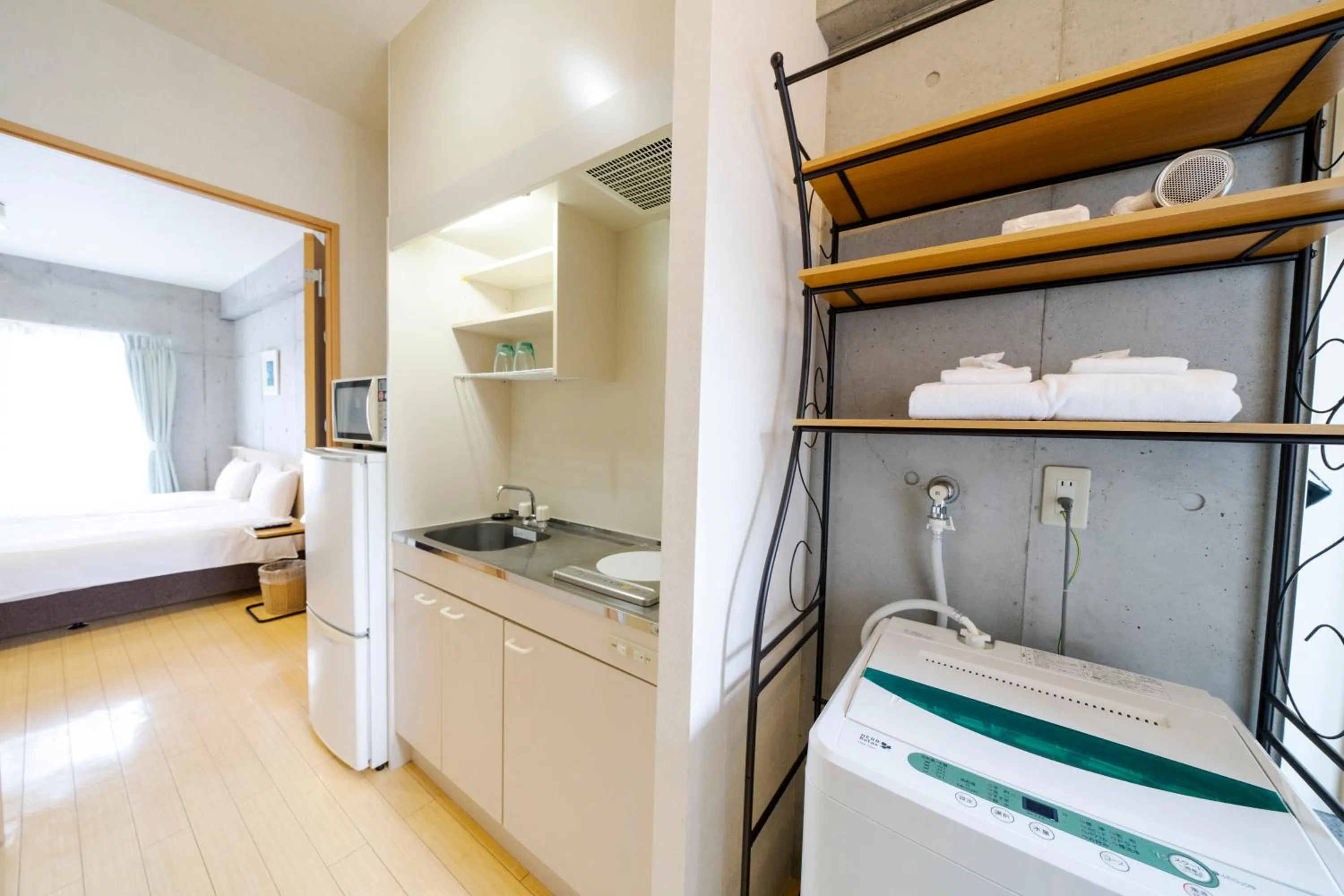 Kitchen or kitchenette, Bed in NAHA-WEST INN