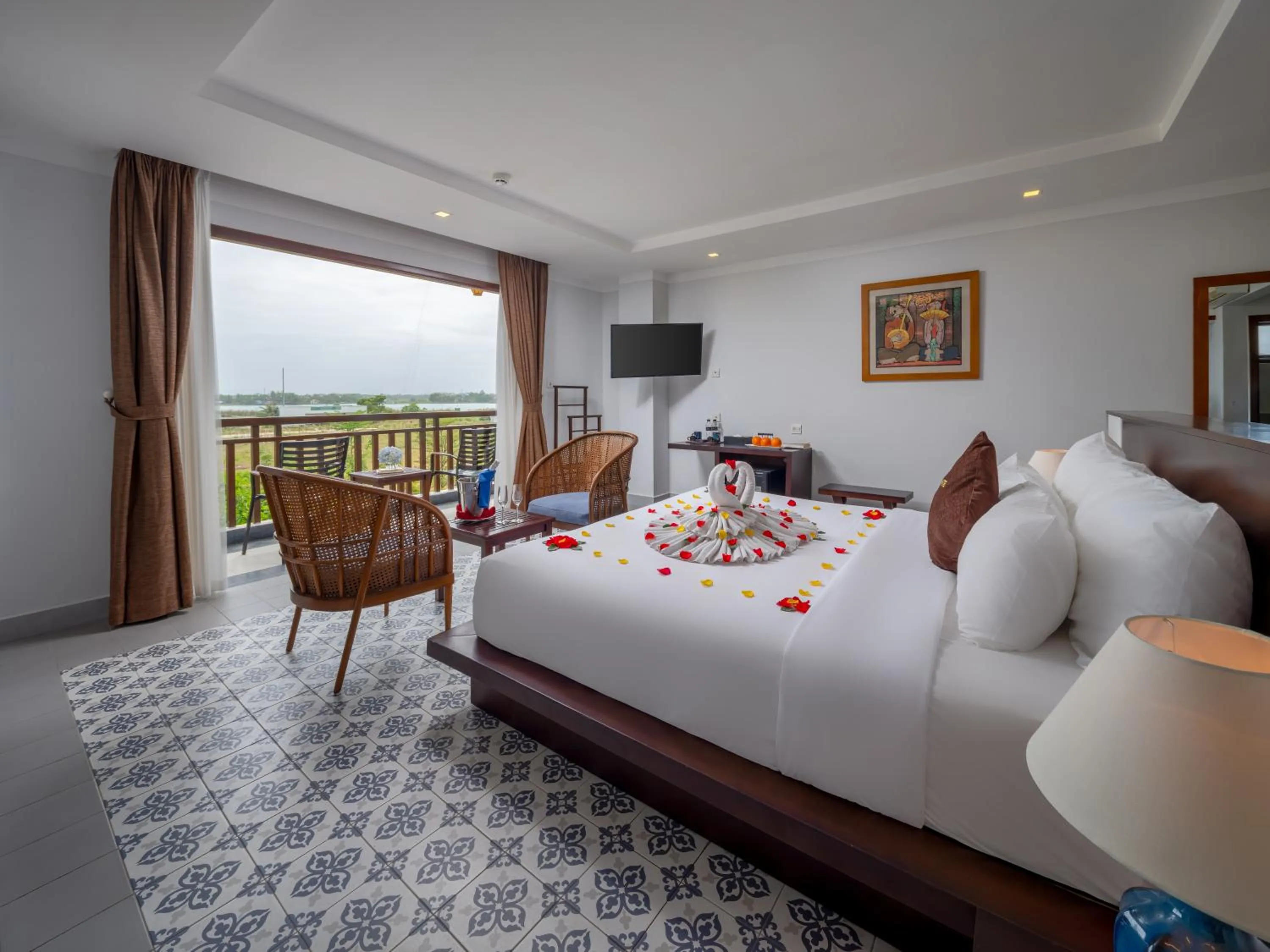 Communal lounge/ TV room, Bed in Hoi An Odyssey Hotel & Spa
