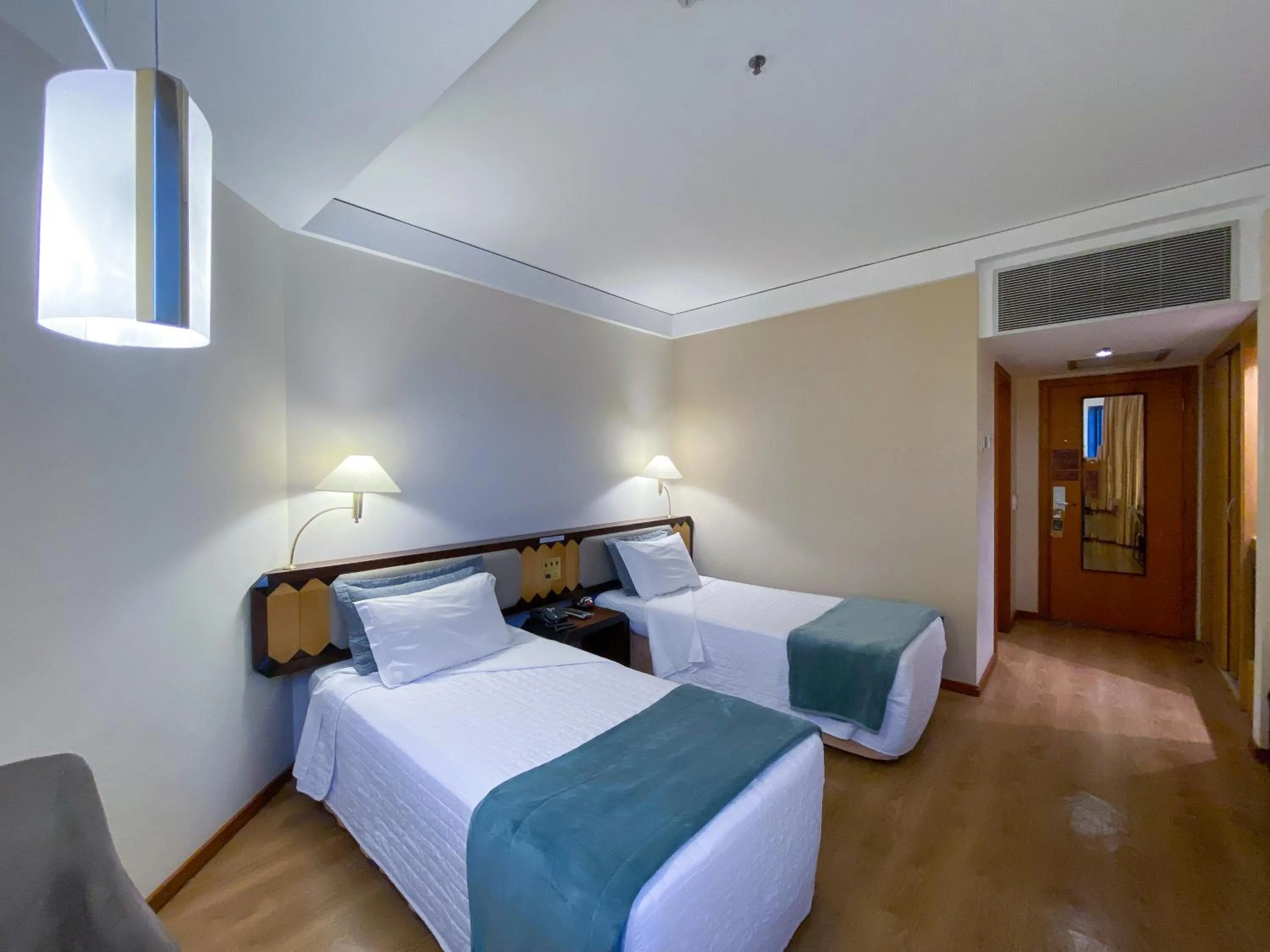 Bed in Golden Tower Pinheiros by Fênix Hotéis