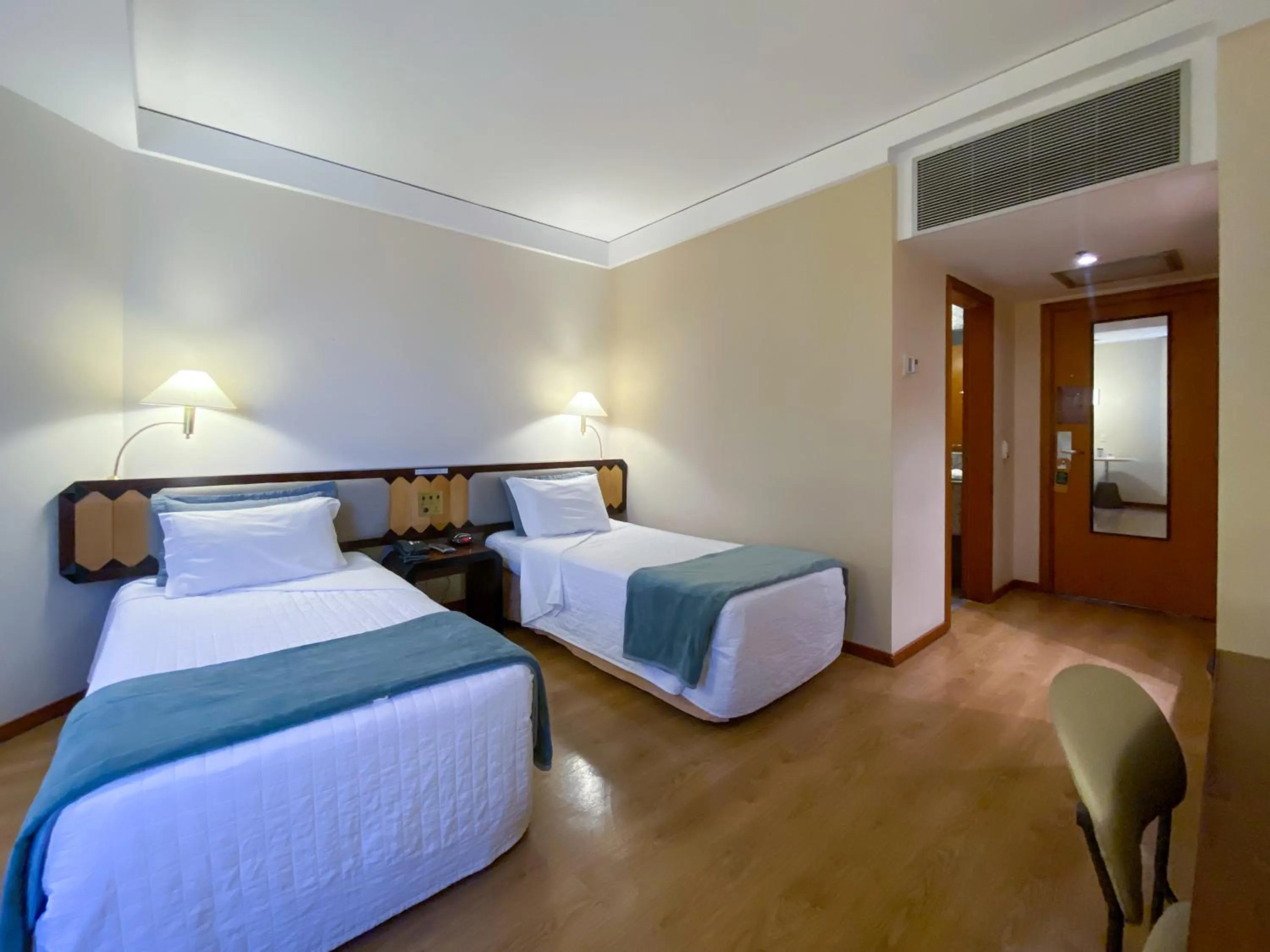 Bed in Golden Tower Pinheiros by Fênix Hotéis