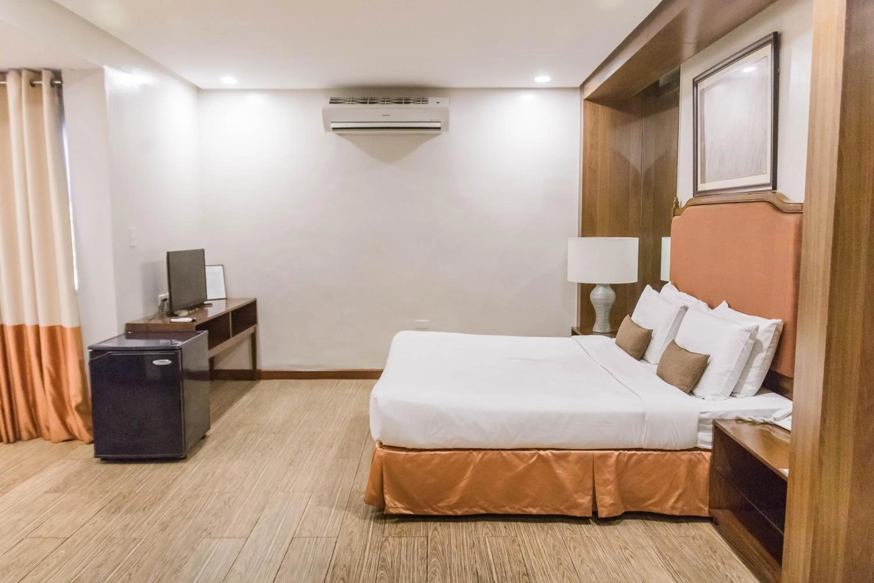 Bed in La Fiesta Hotel