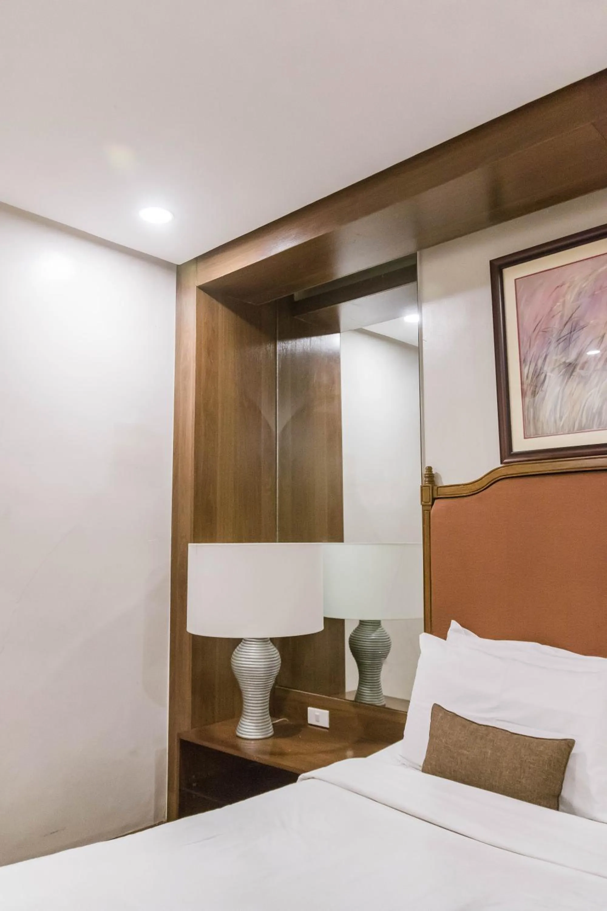 Bed in La Fiesta Hotel