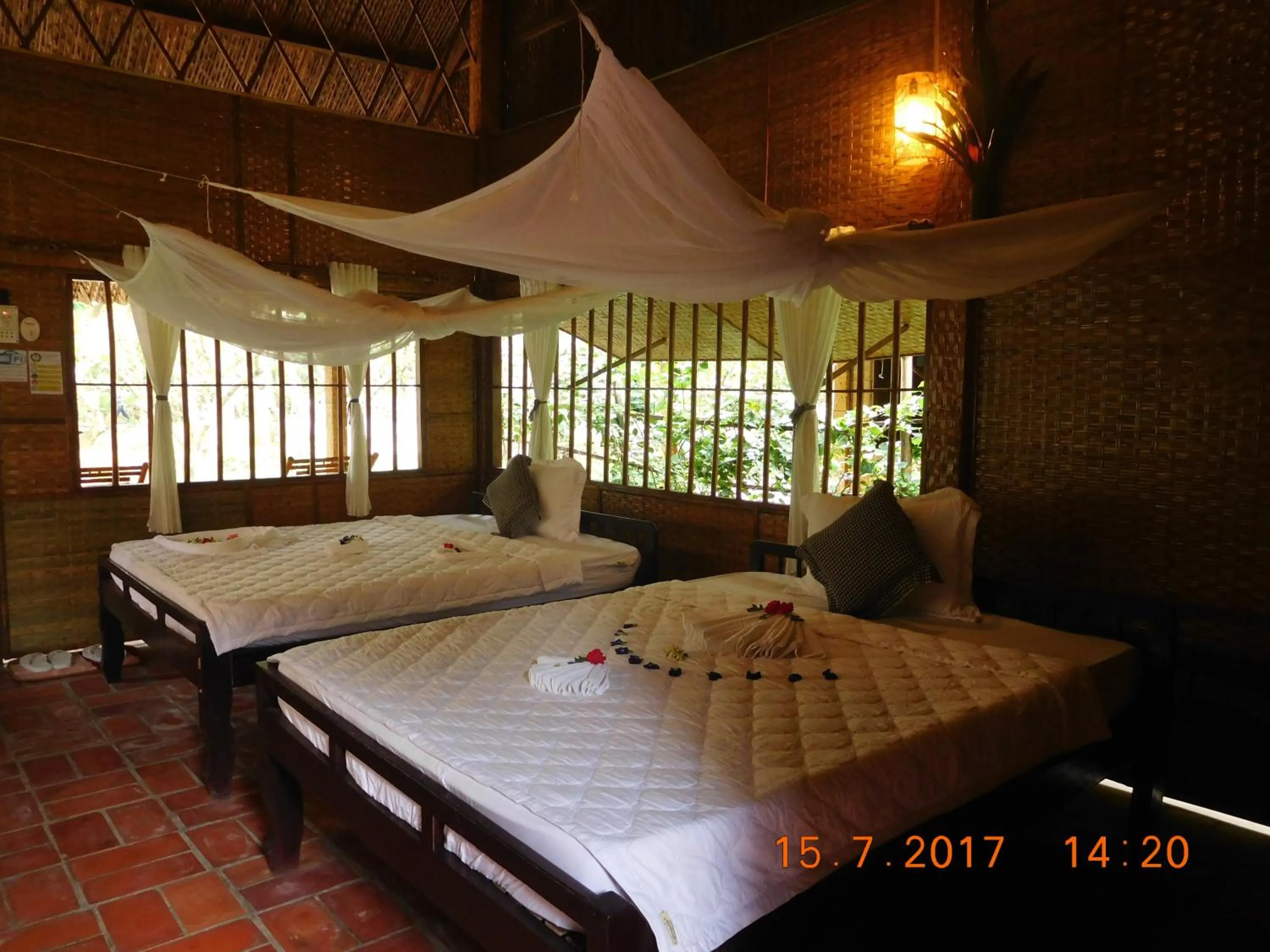 Bed in Mekong Ecolodge Bungalow