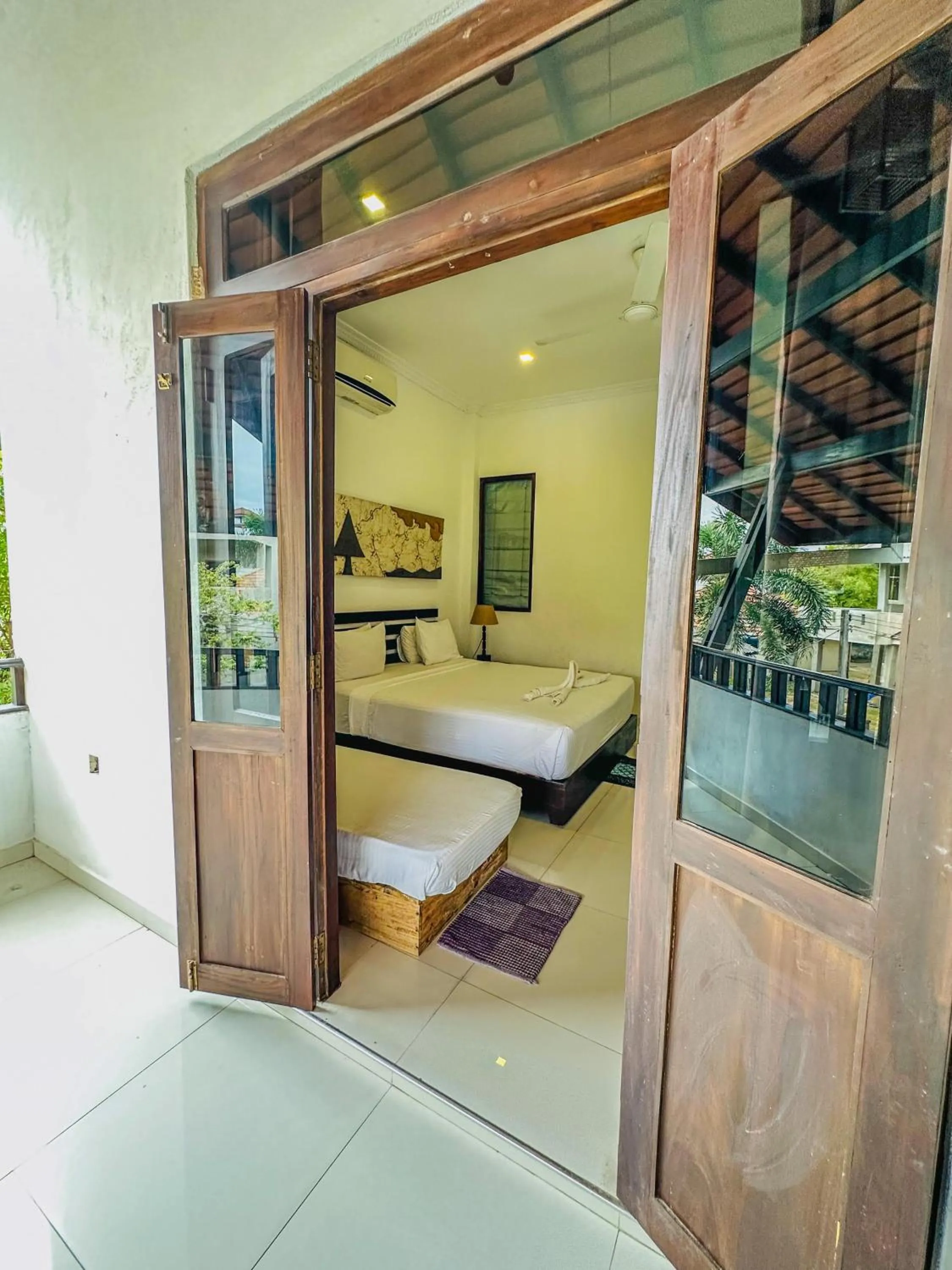 Bed in Sunrise Palace Negombo