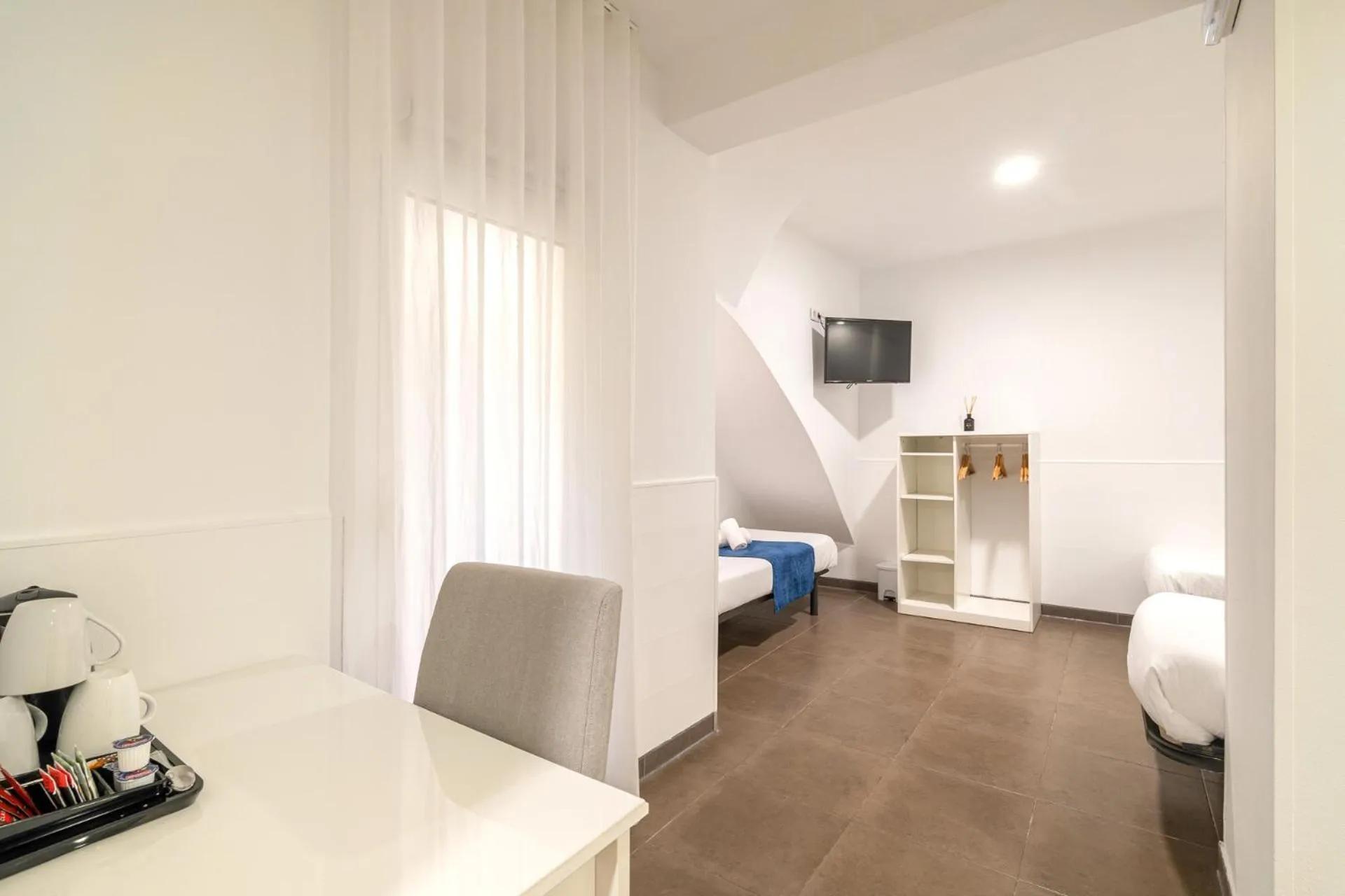 Bed in Laramond Barcelona Rooms