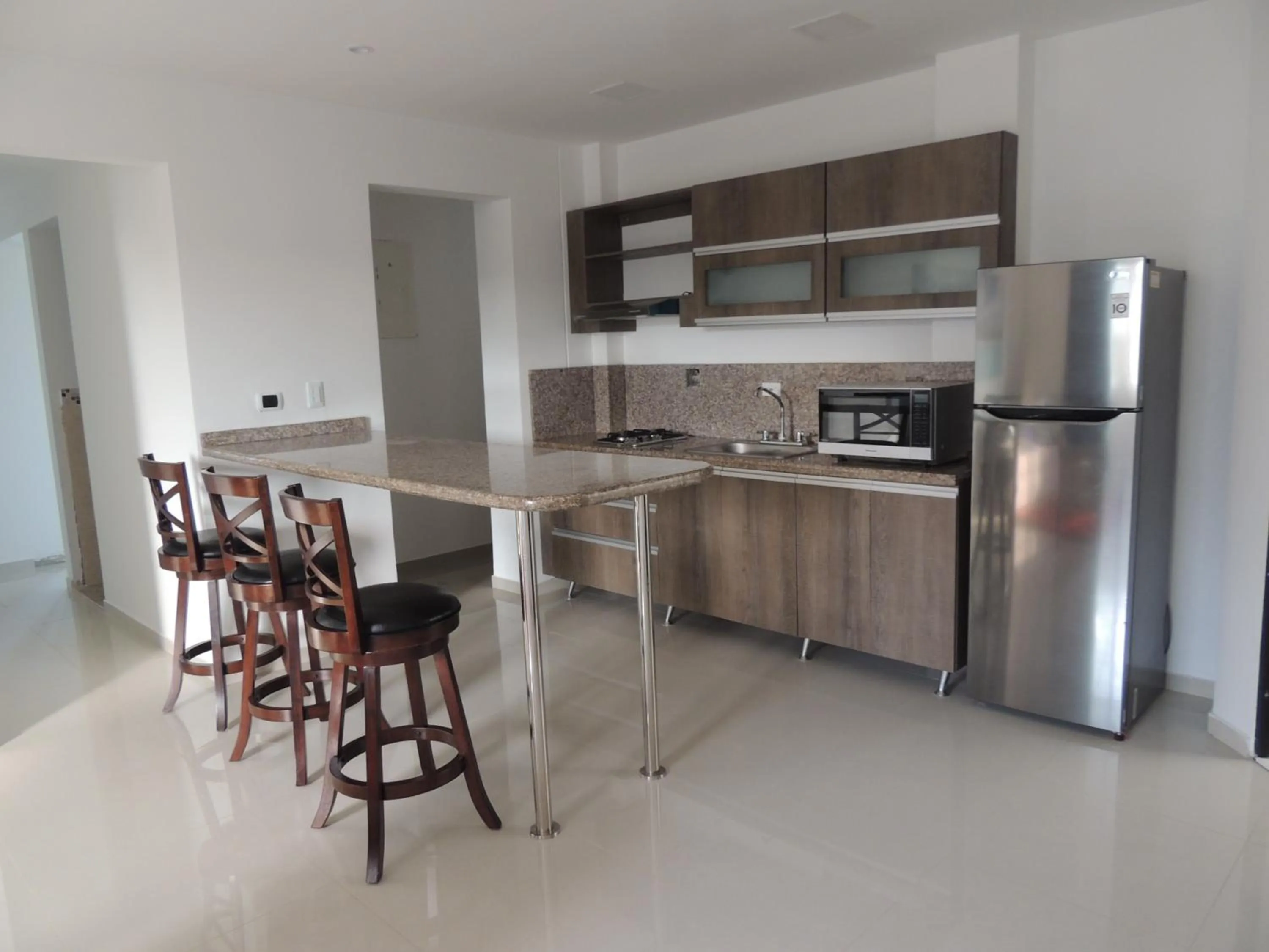 Kitchen or kitchenette in Sea Colors Apartments