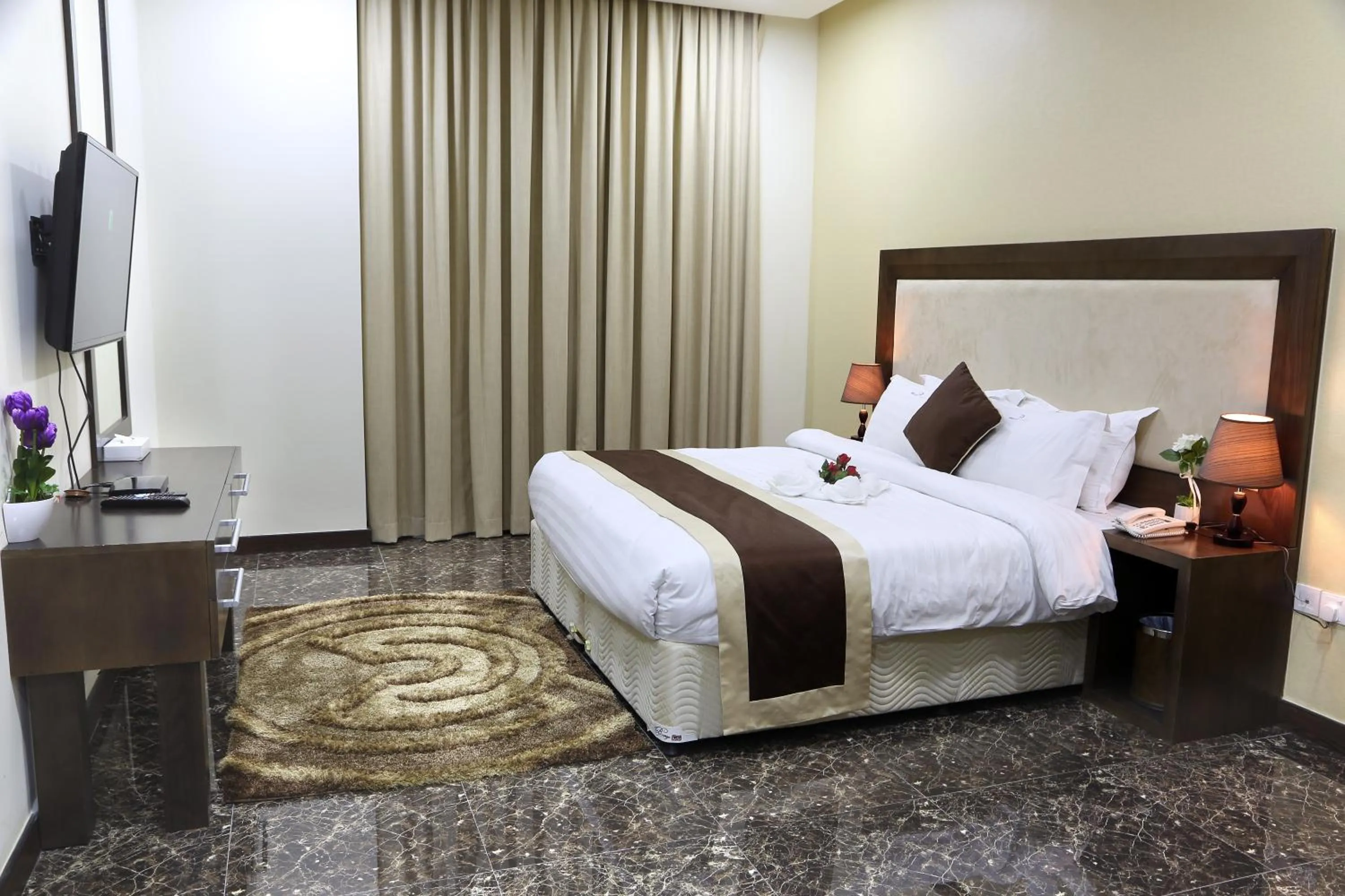 Photo of the whole room, Bed in Belle Tower Apartments