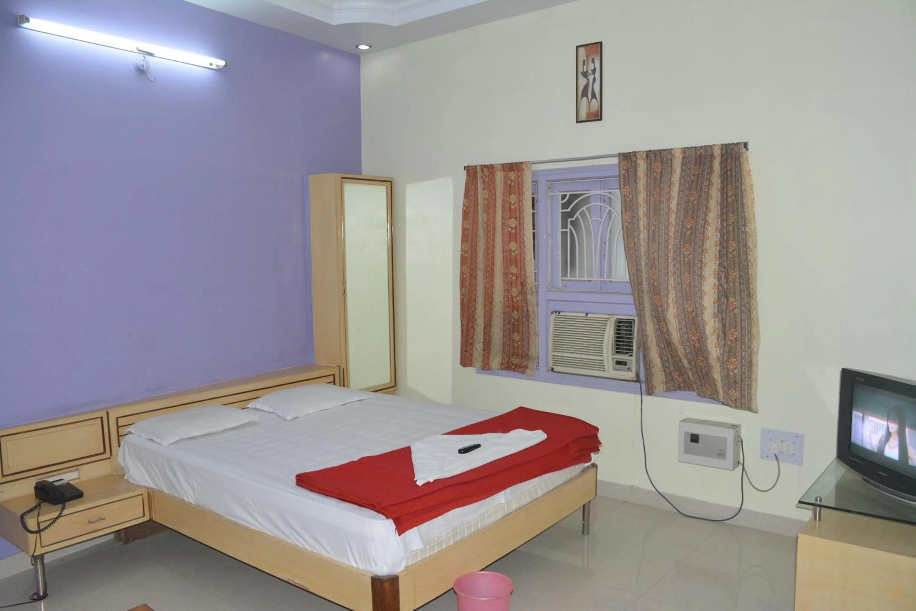 Bed in Hotel Naveen Residency