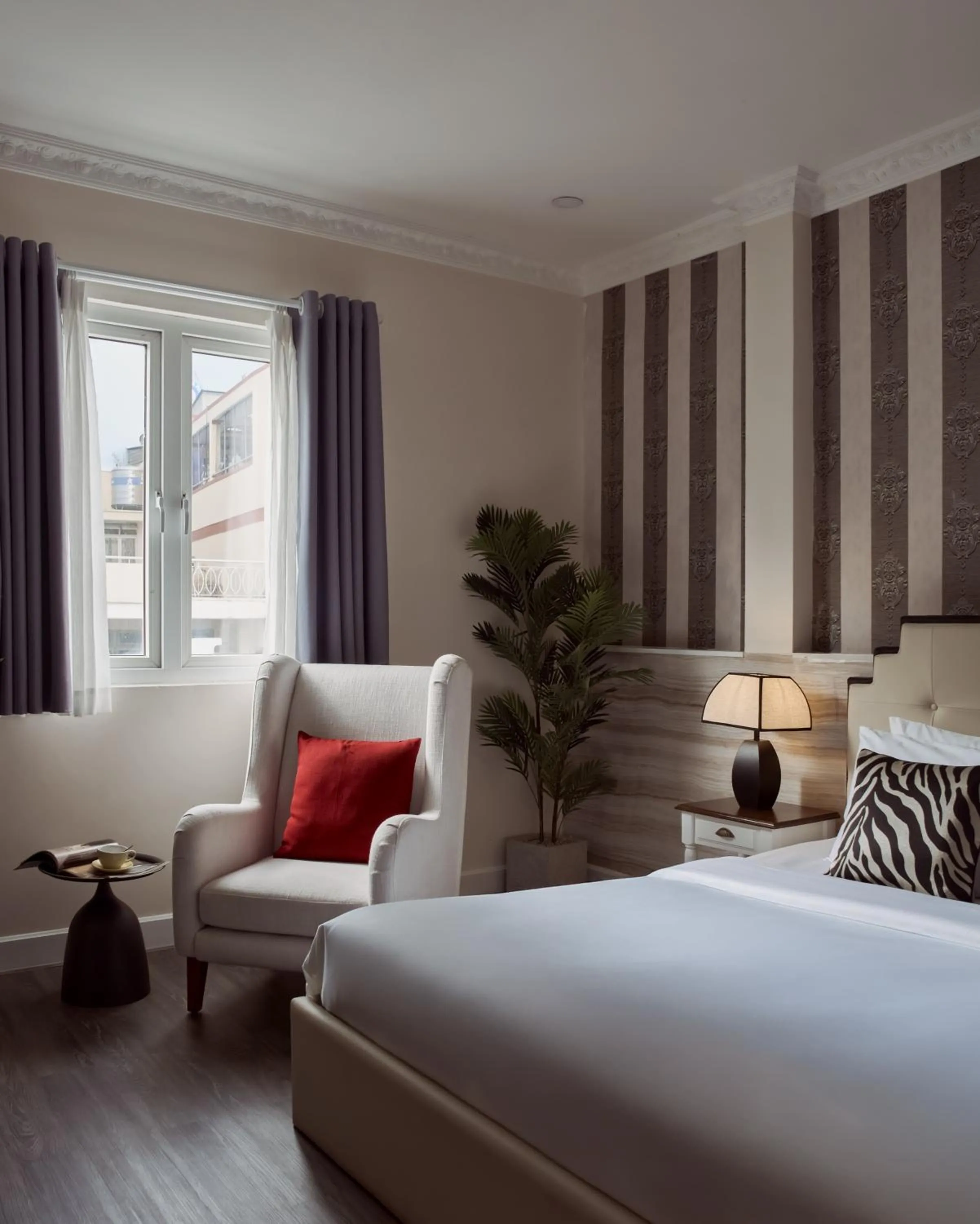 Seating area, Bed in The One Ben Thanh Hotel-City Center