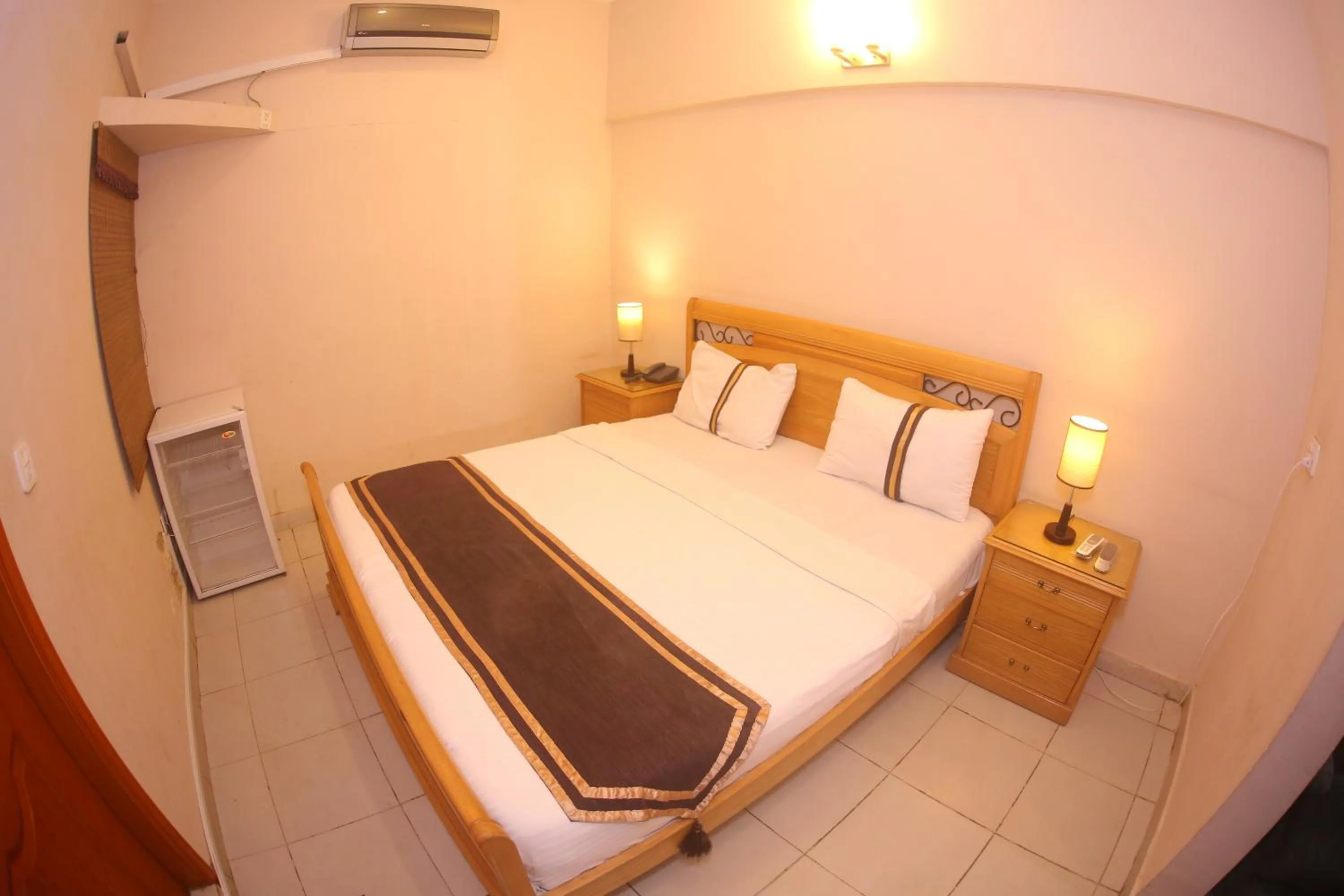 Bed in Royal Inn Hotel