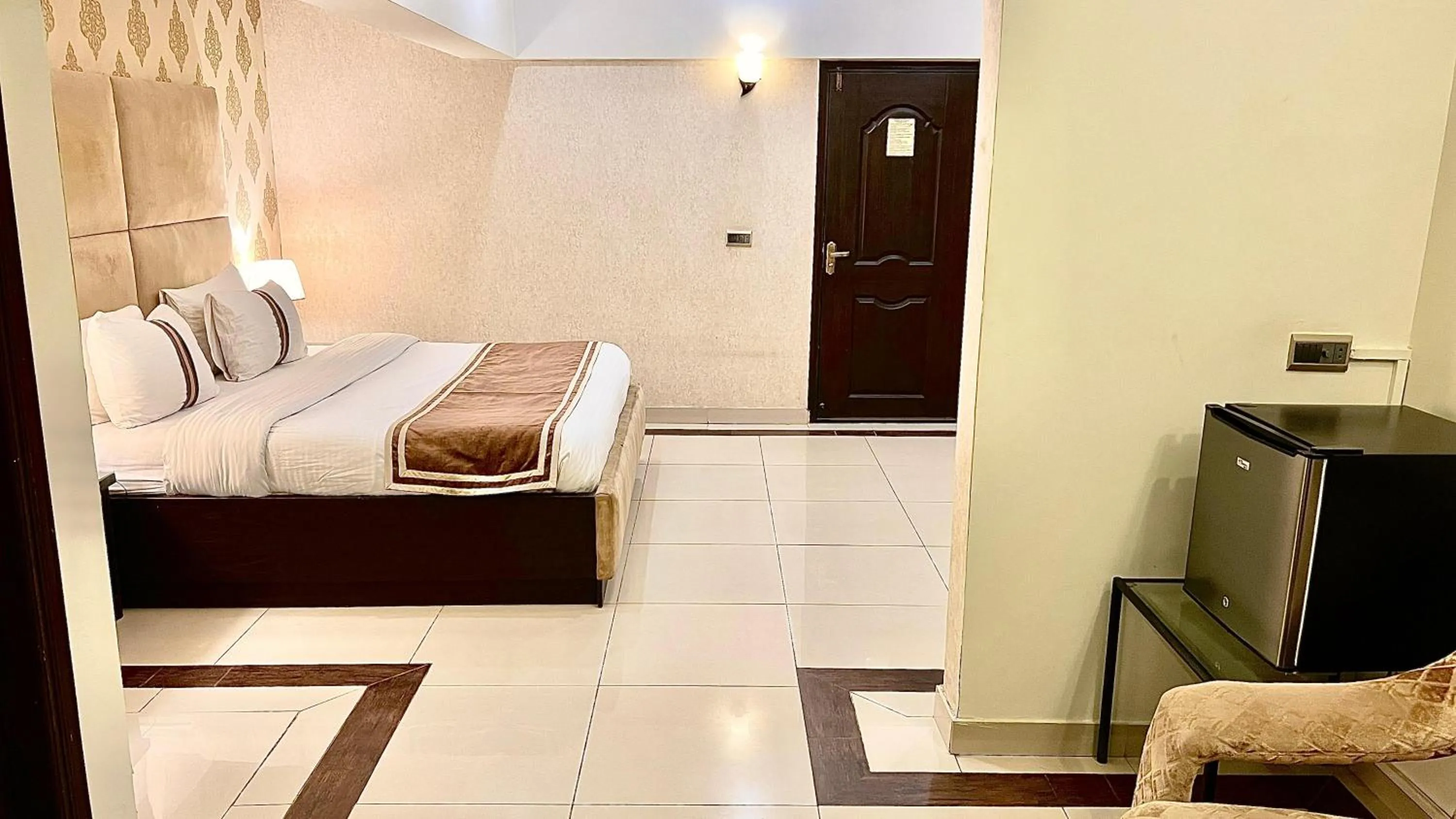 Bed in Royal Inn Hotel