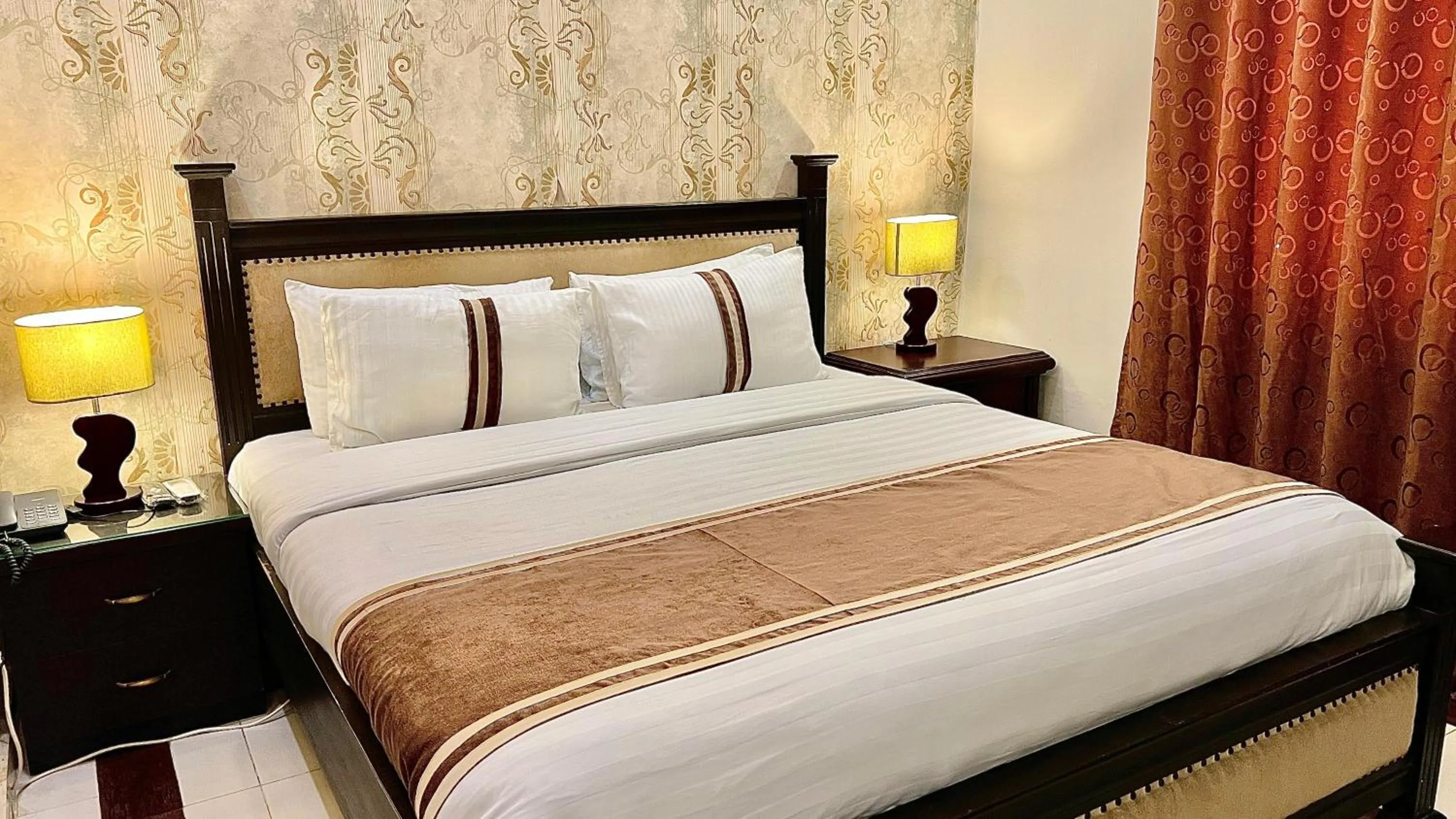 Bed in Royal Inn Hotel