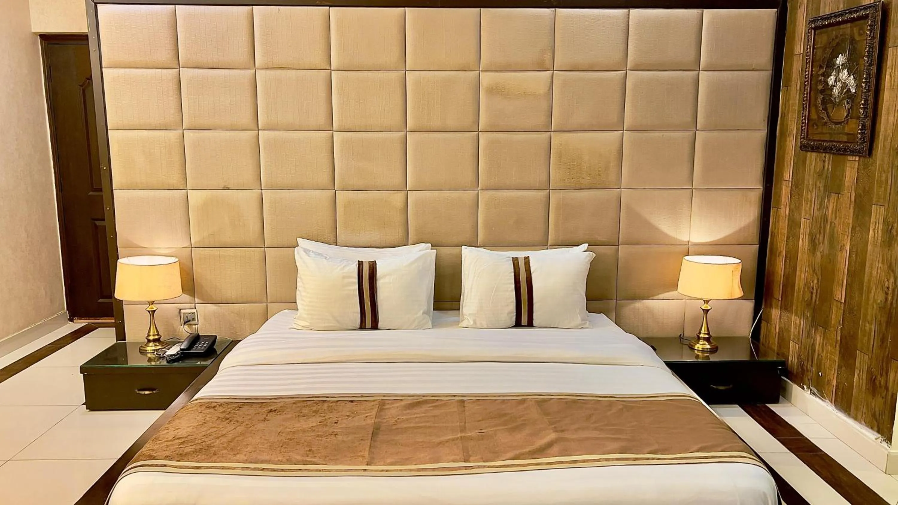 Bed in Royal Inn Hotel