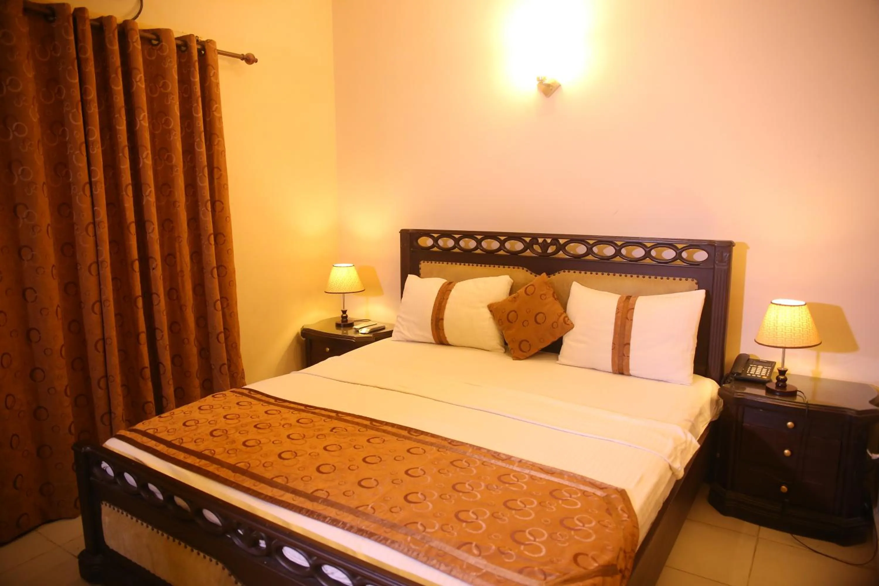 Bed in Royal Inn Hotel