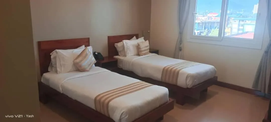 Bed in Venus Premier Hotel