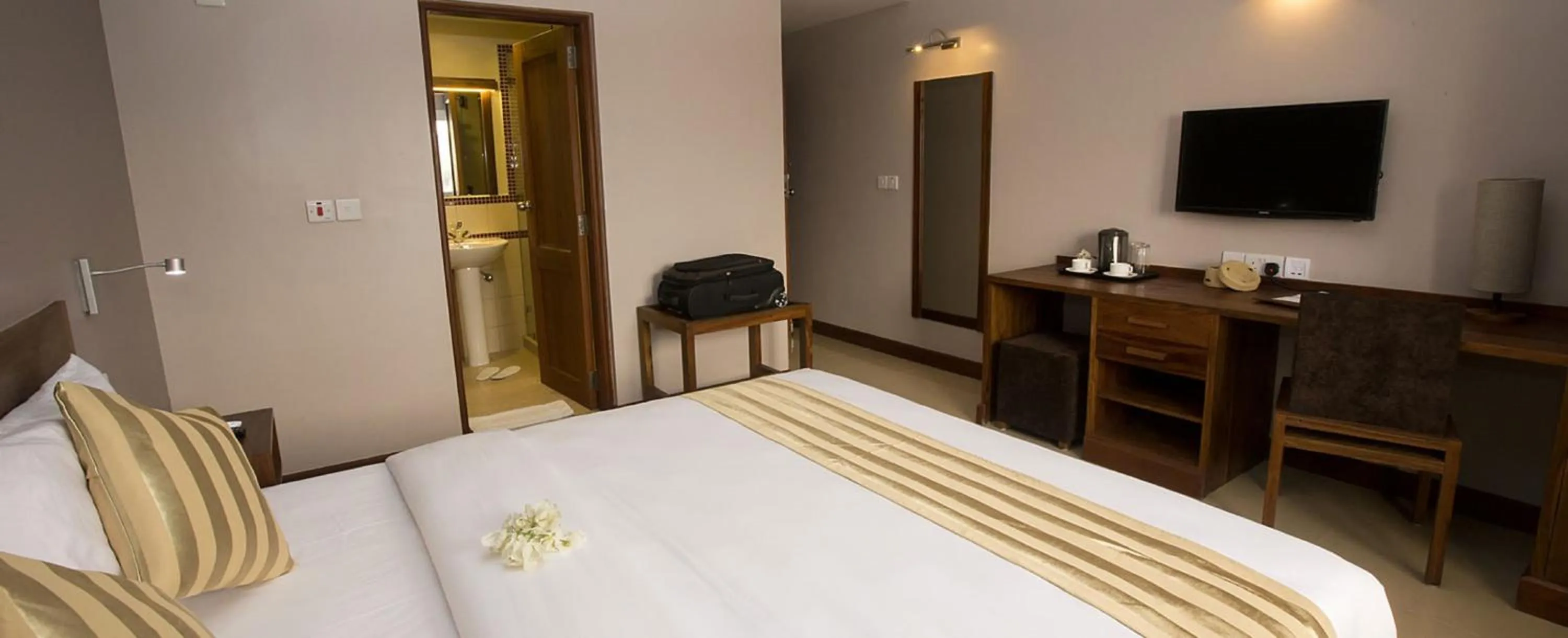 Bed in Venus Premier Hotel