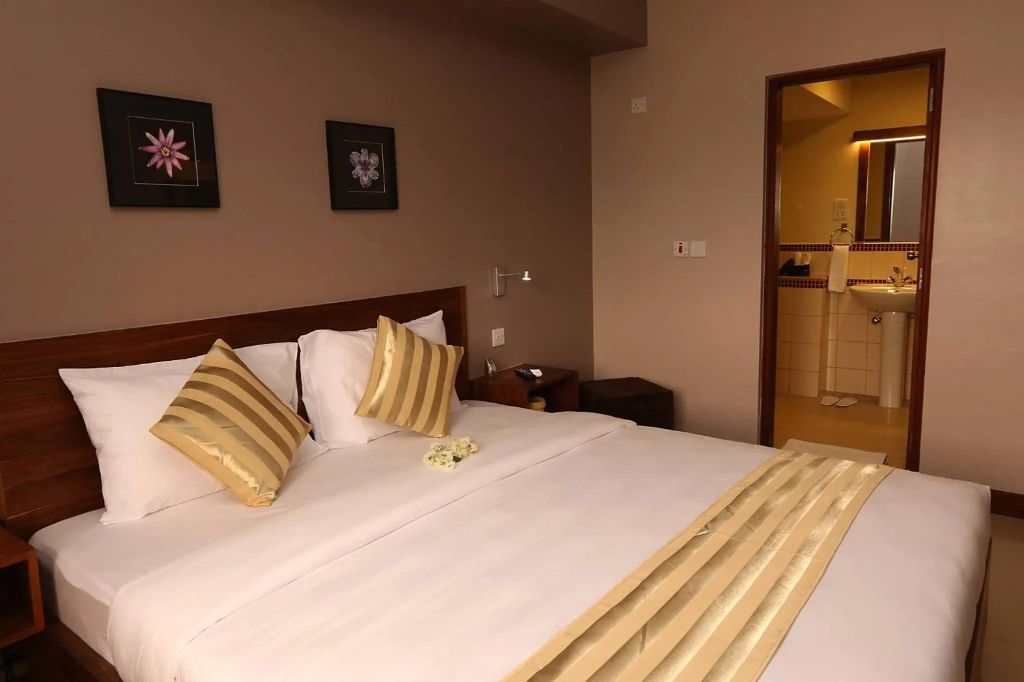 Bed in Venus Premier Hotel