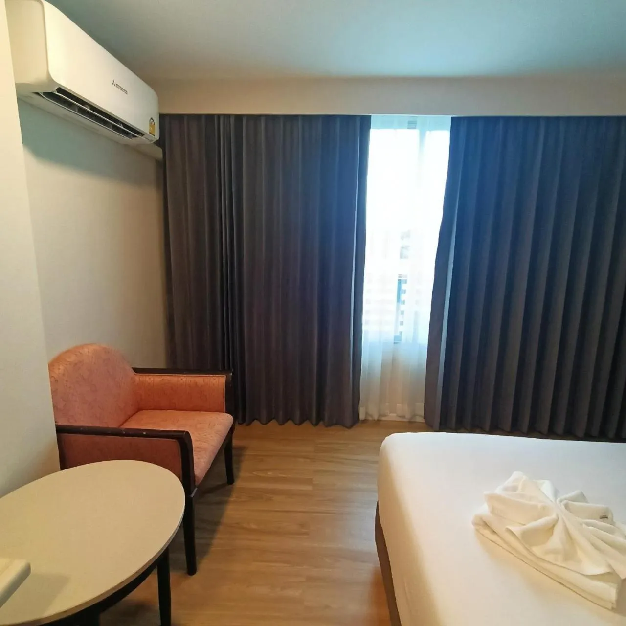 air conditioner, Bed in Mayflower Grande Hotel Phitsanulok