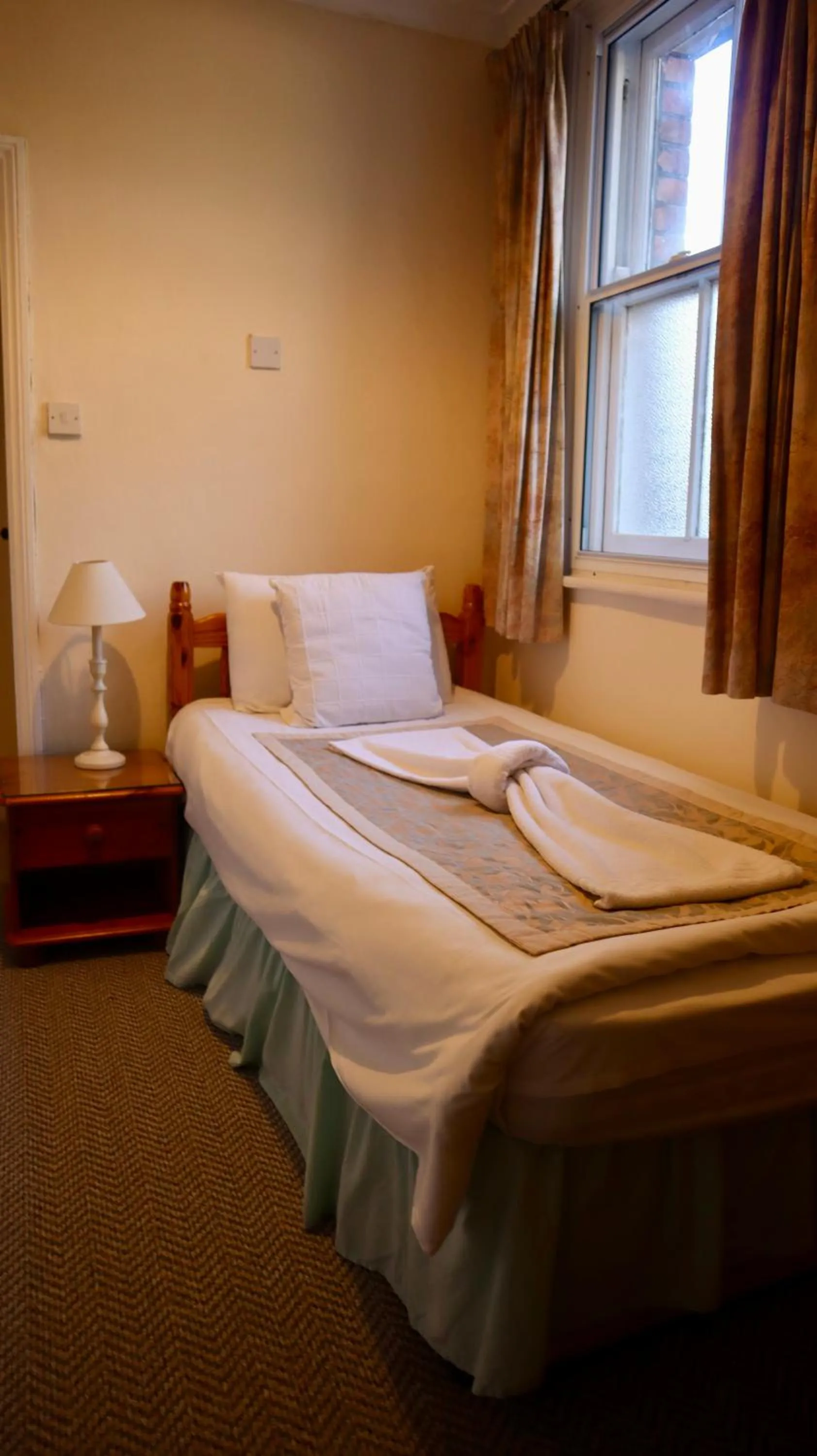 Bed in Pickwicks Guest House