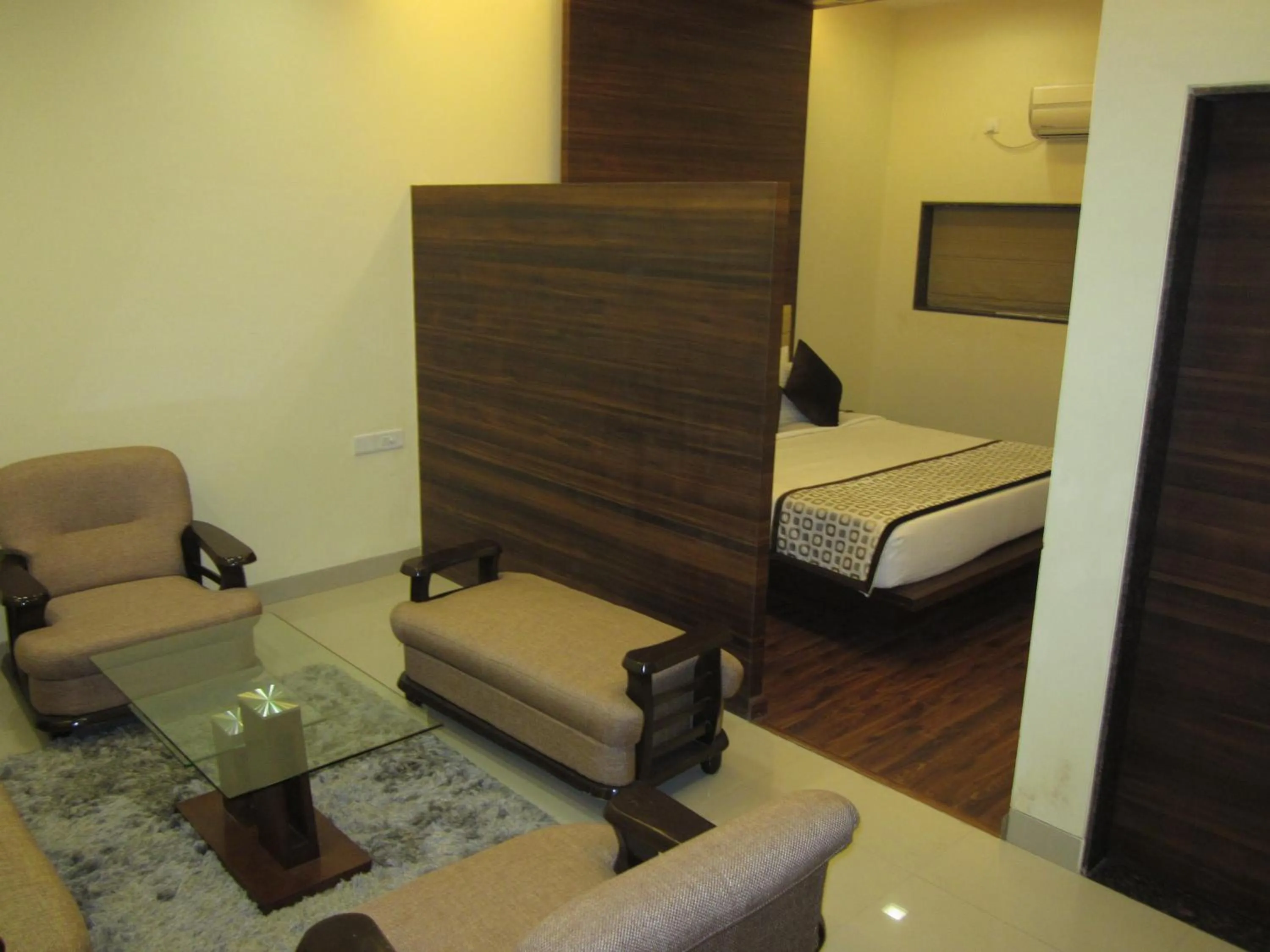 Seating area, Bed in Vijaya Tej Clarks Inn