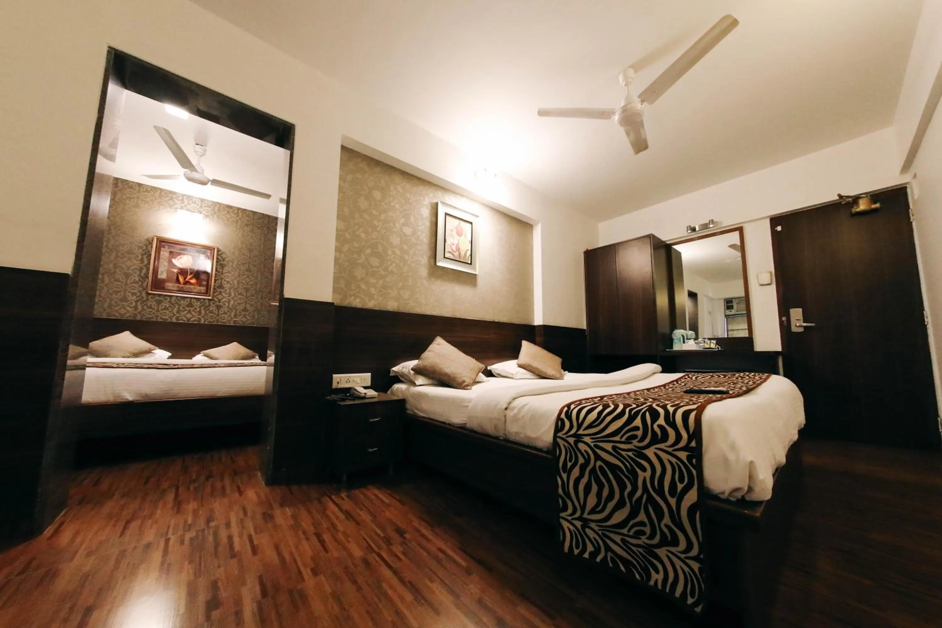 Photo of the whole room, Bed in Hotel Maharana Inn Chembur