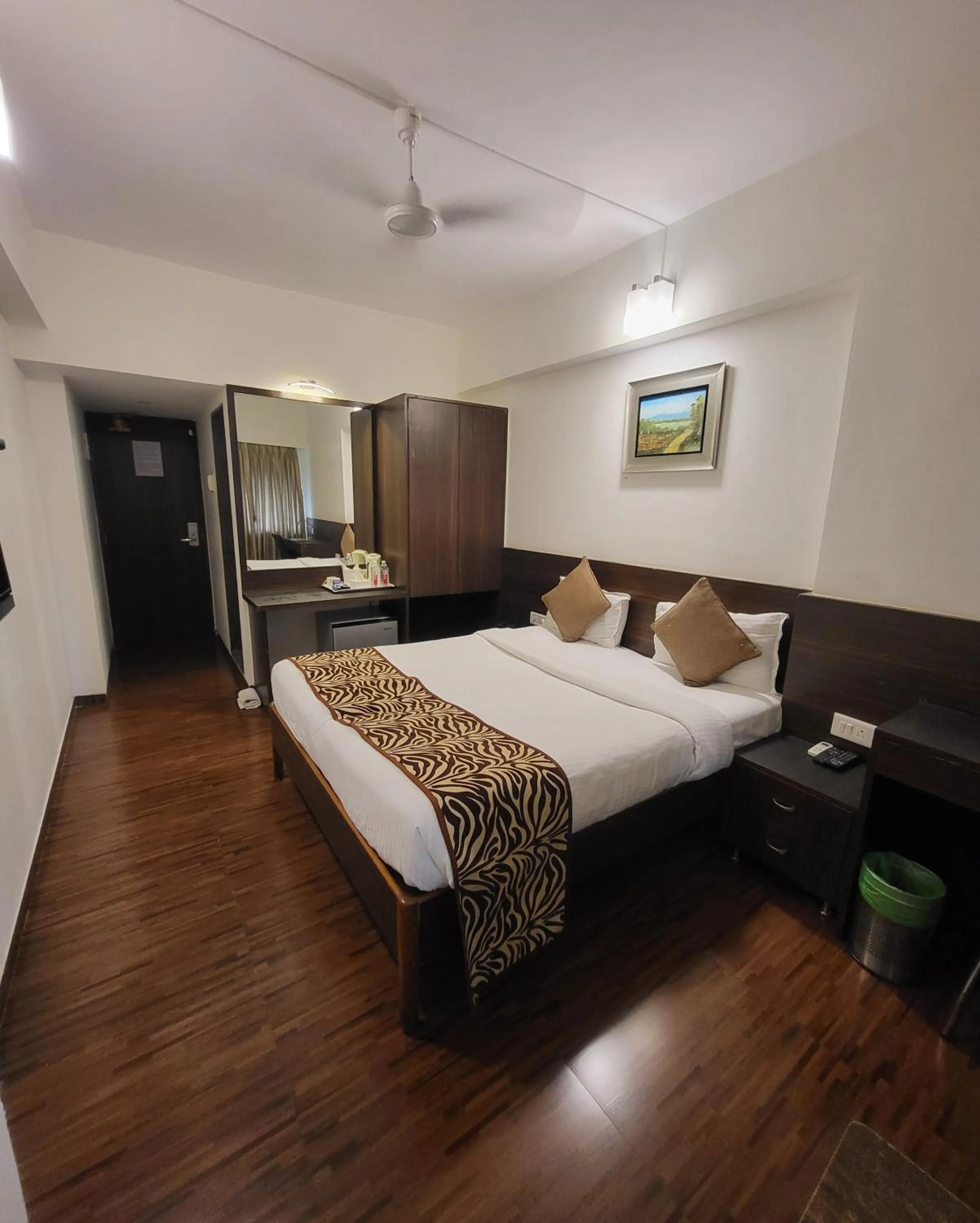 Photo of the whole room, Bed in Hotel Maharana Inn Chembur