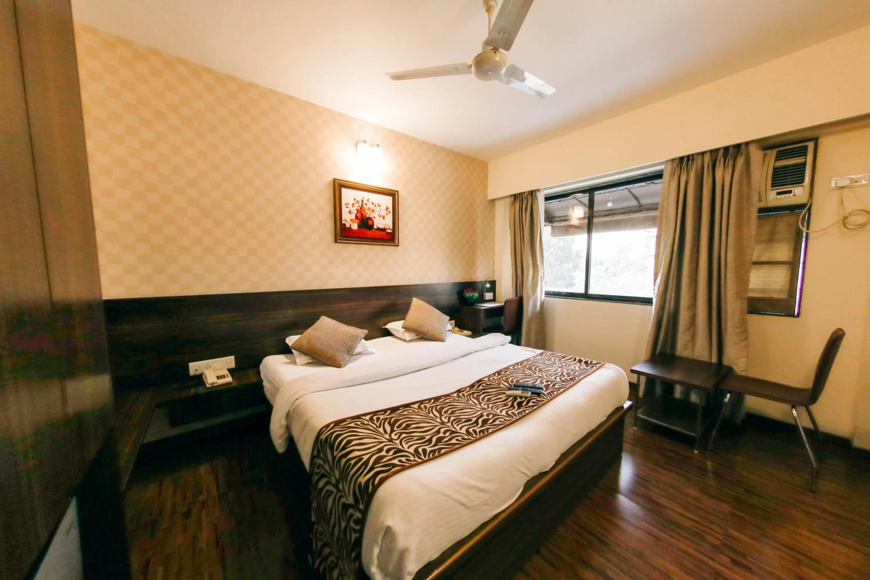 Photo of the whole room, Bed in Hotel Maharana Inn Chembur