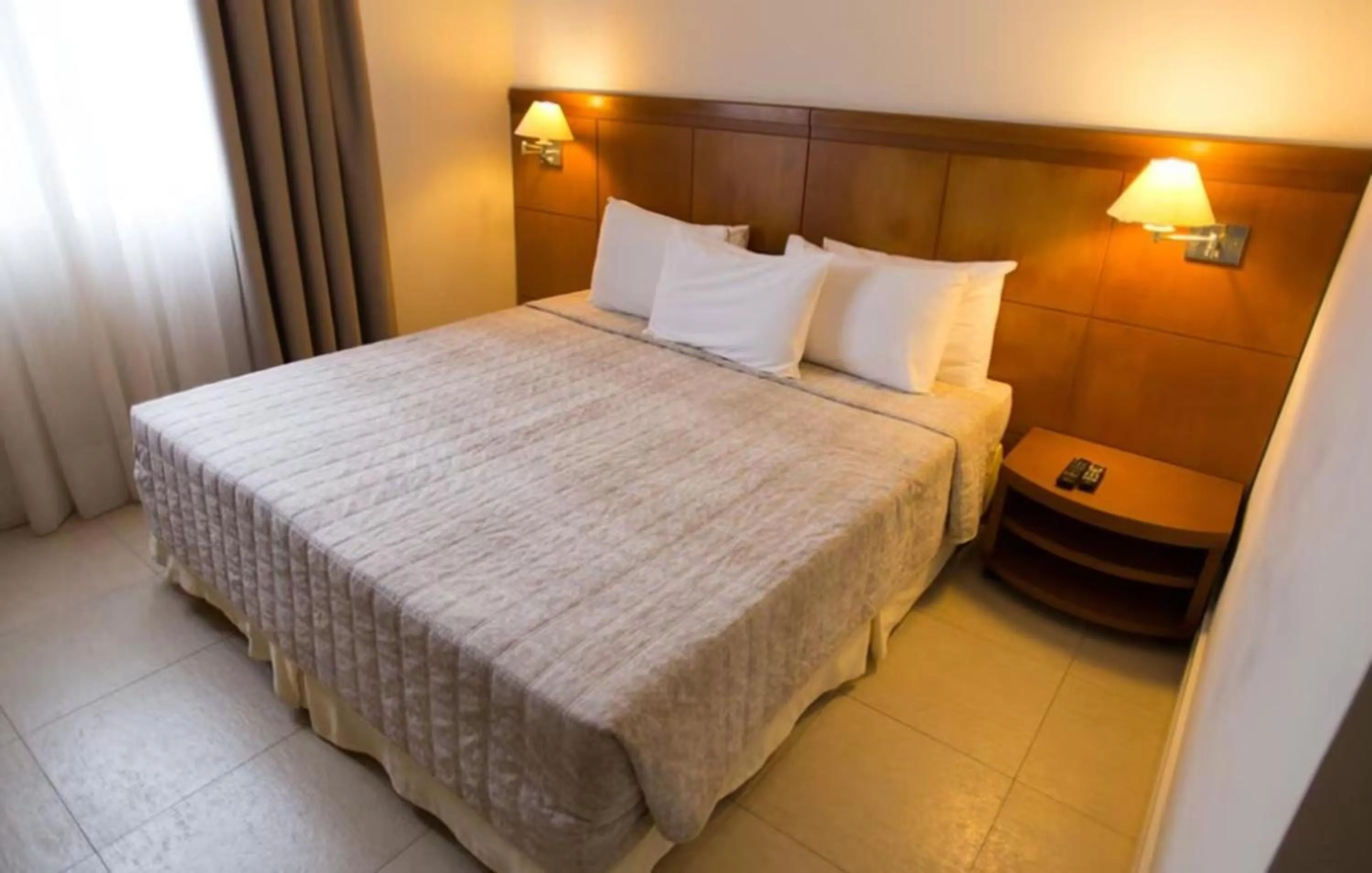 Bed in Le Village Flats e Hotel