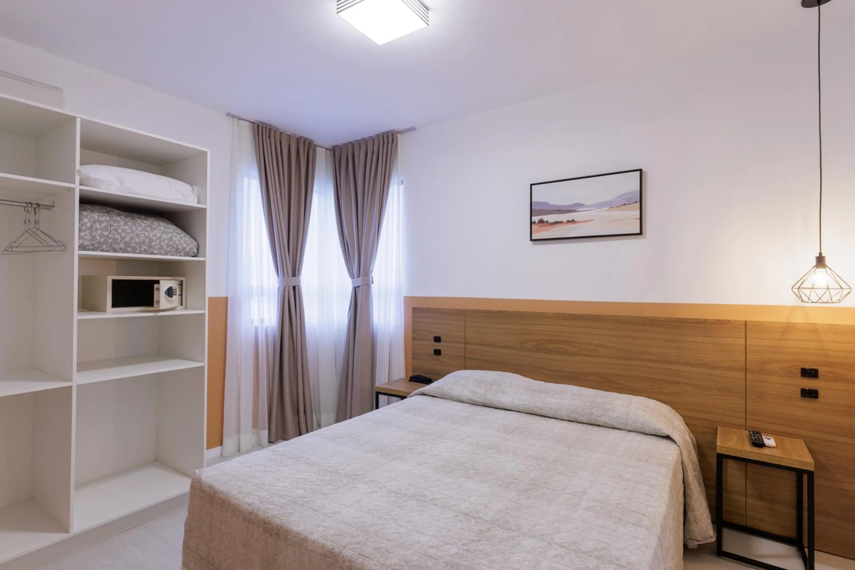 Bed in Le Village Flats e Hotel