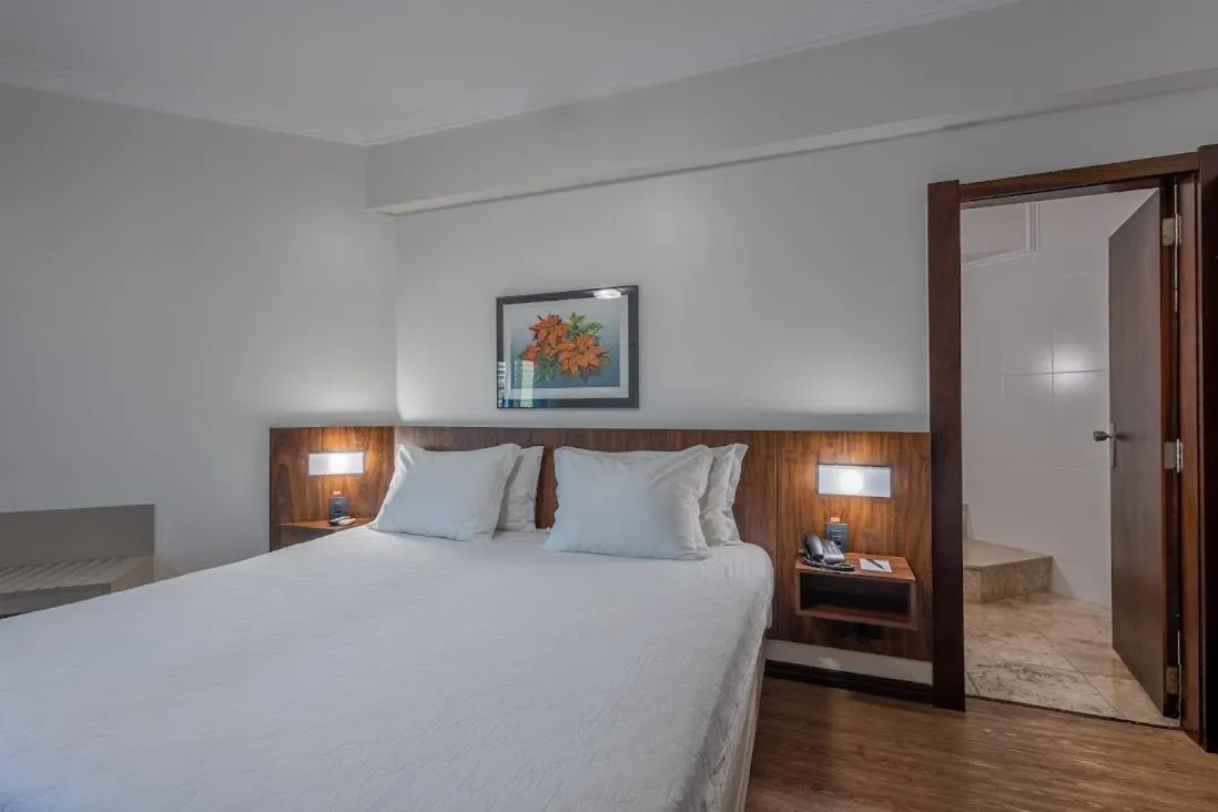 Bed in Plaza Blumenau Hotel