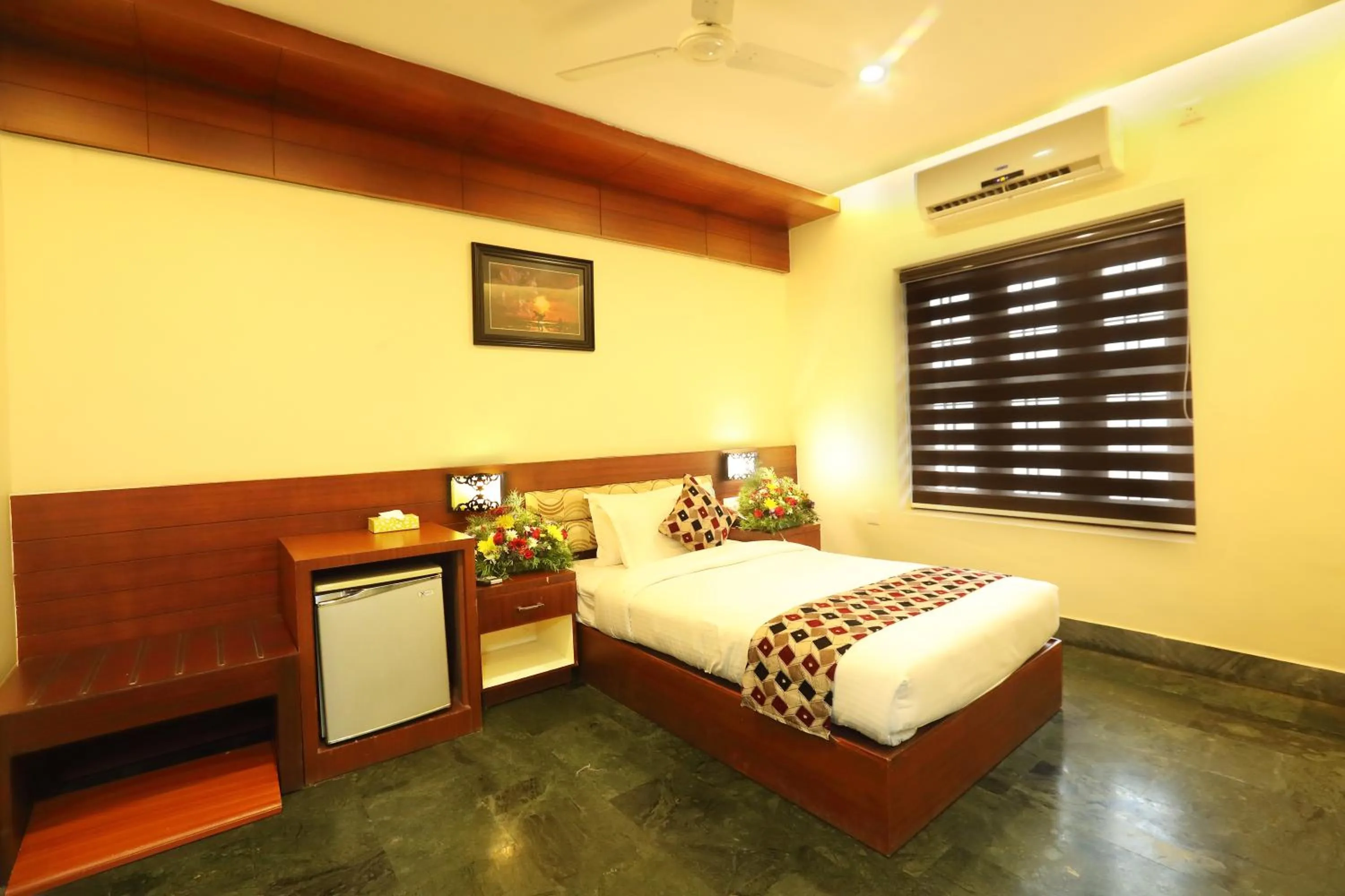 Bed in Hotel Indraprastha varkala