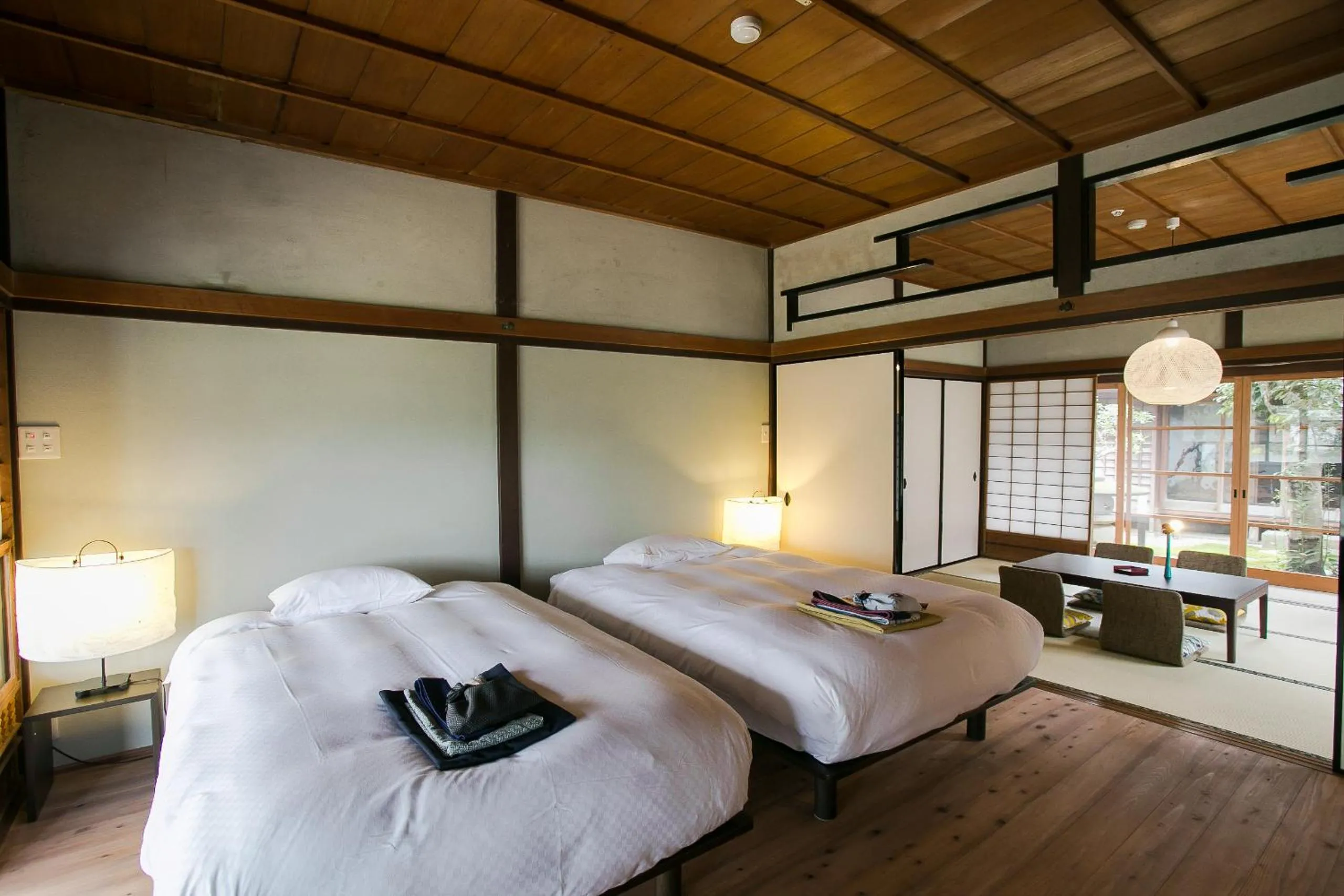 Bed in NIPPONIA Sasayama Castle Town Hotel