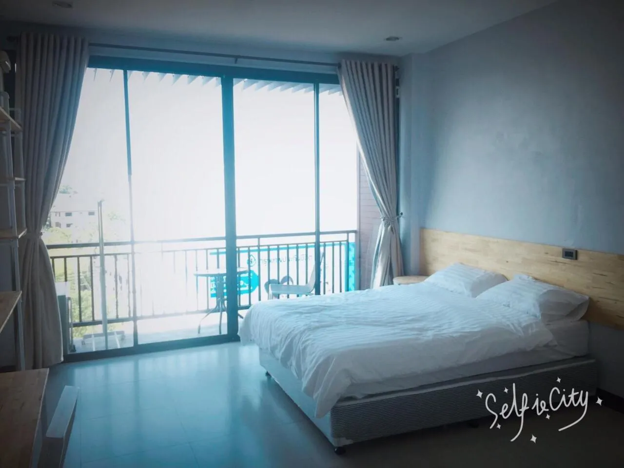 Photo of the whole room, Bed in Rinrada Loft Resident