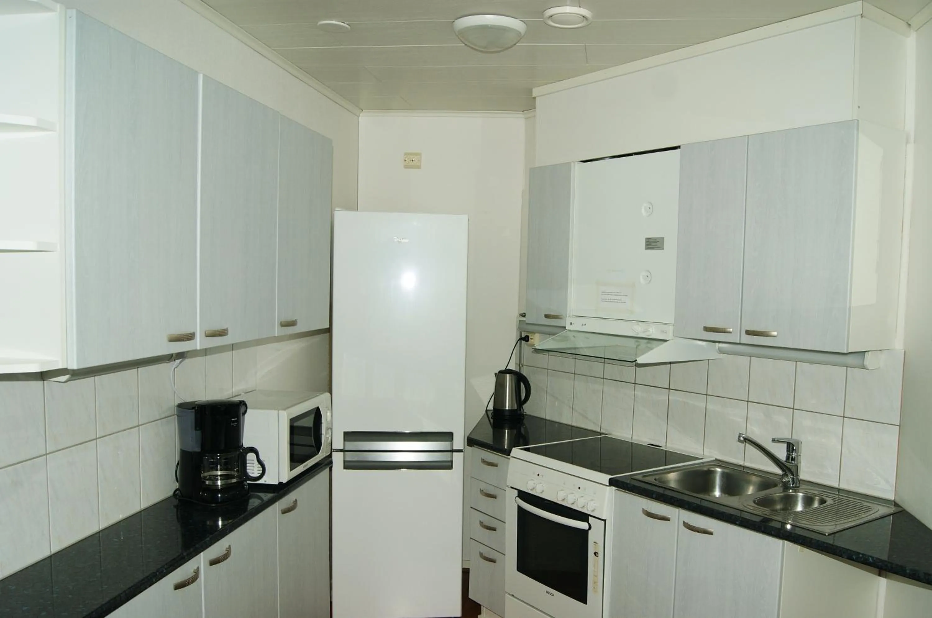 Kitchen or kitchenette in Hotelli Kontio