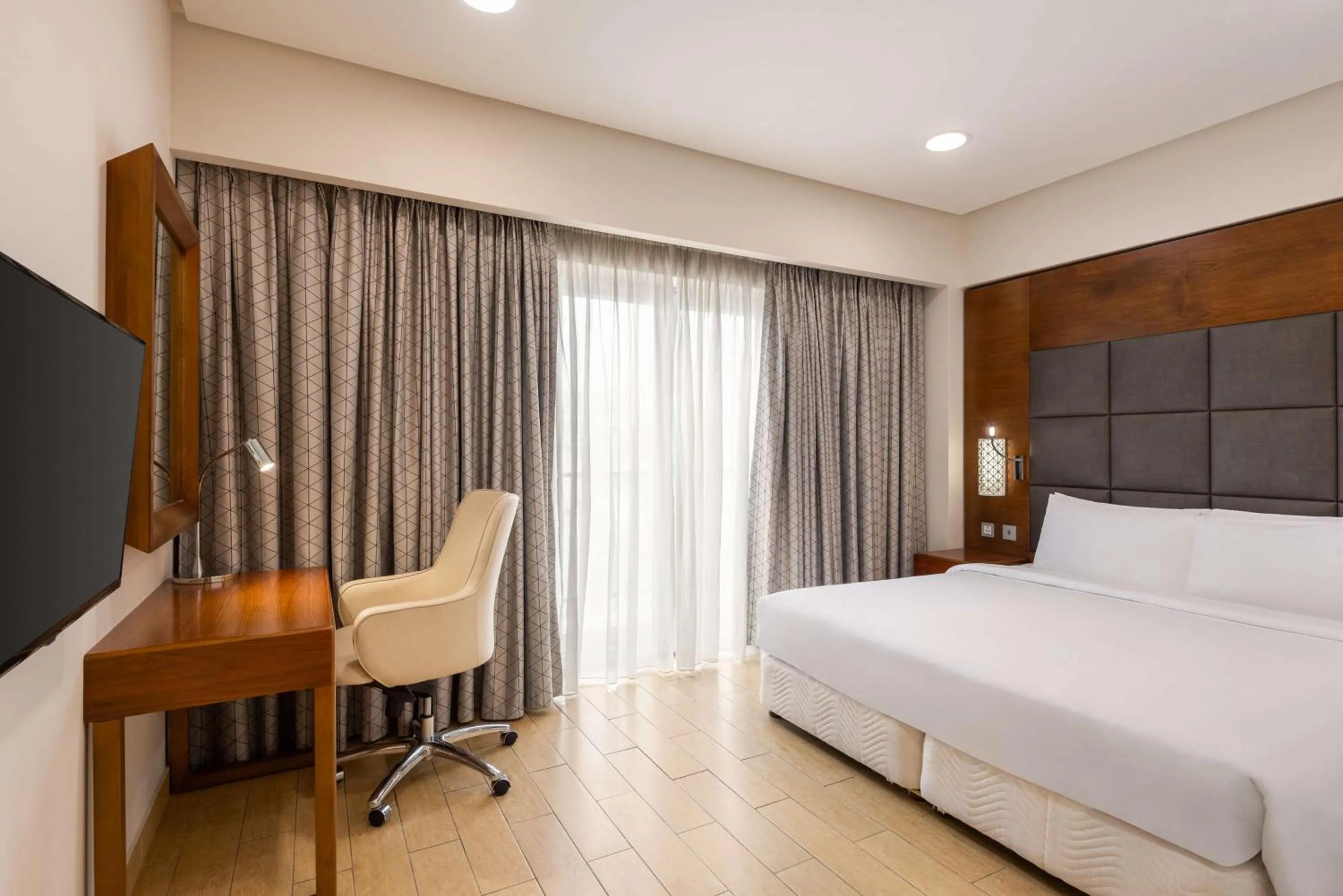 Photo of the whole room, Bed in Levatio Suites Muscat, a member of Radisson Individuals