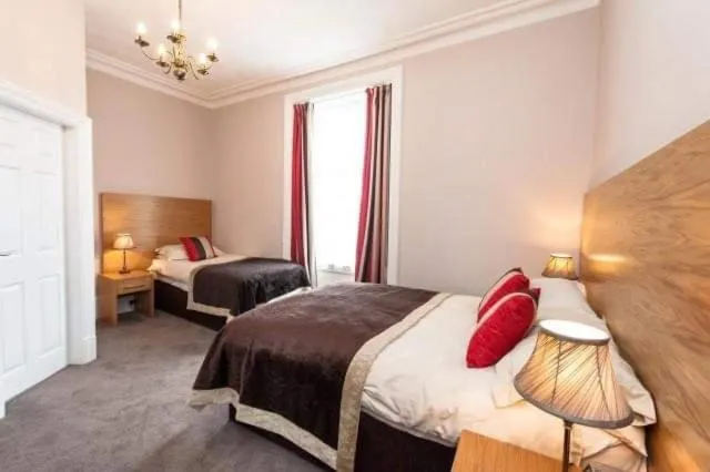 Bed in Belvedere Guest House