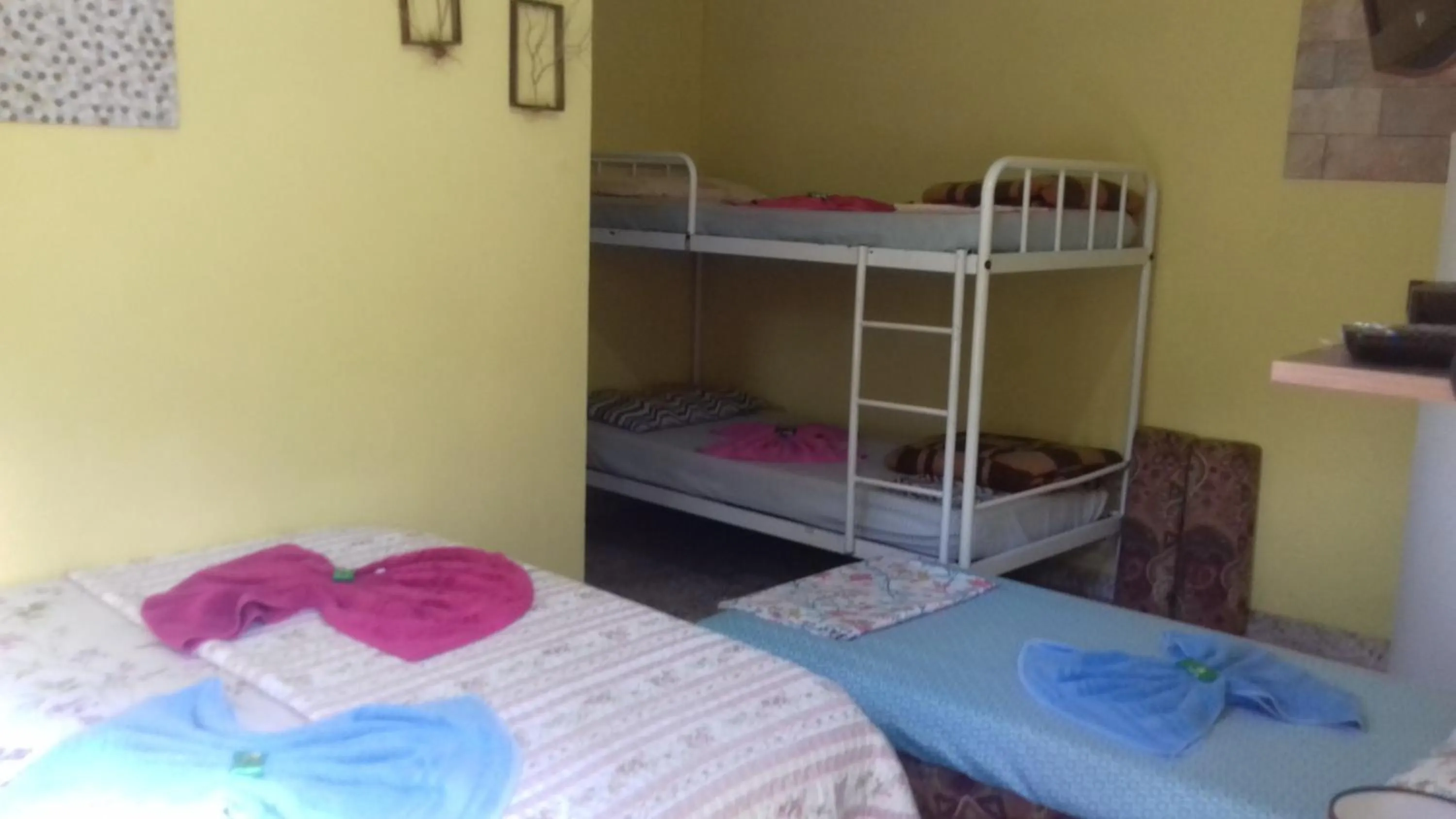 Bed in Sítio e Pousada Recanto Dos Ipês