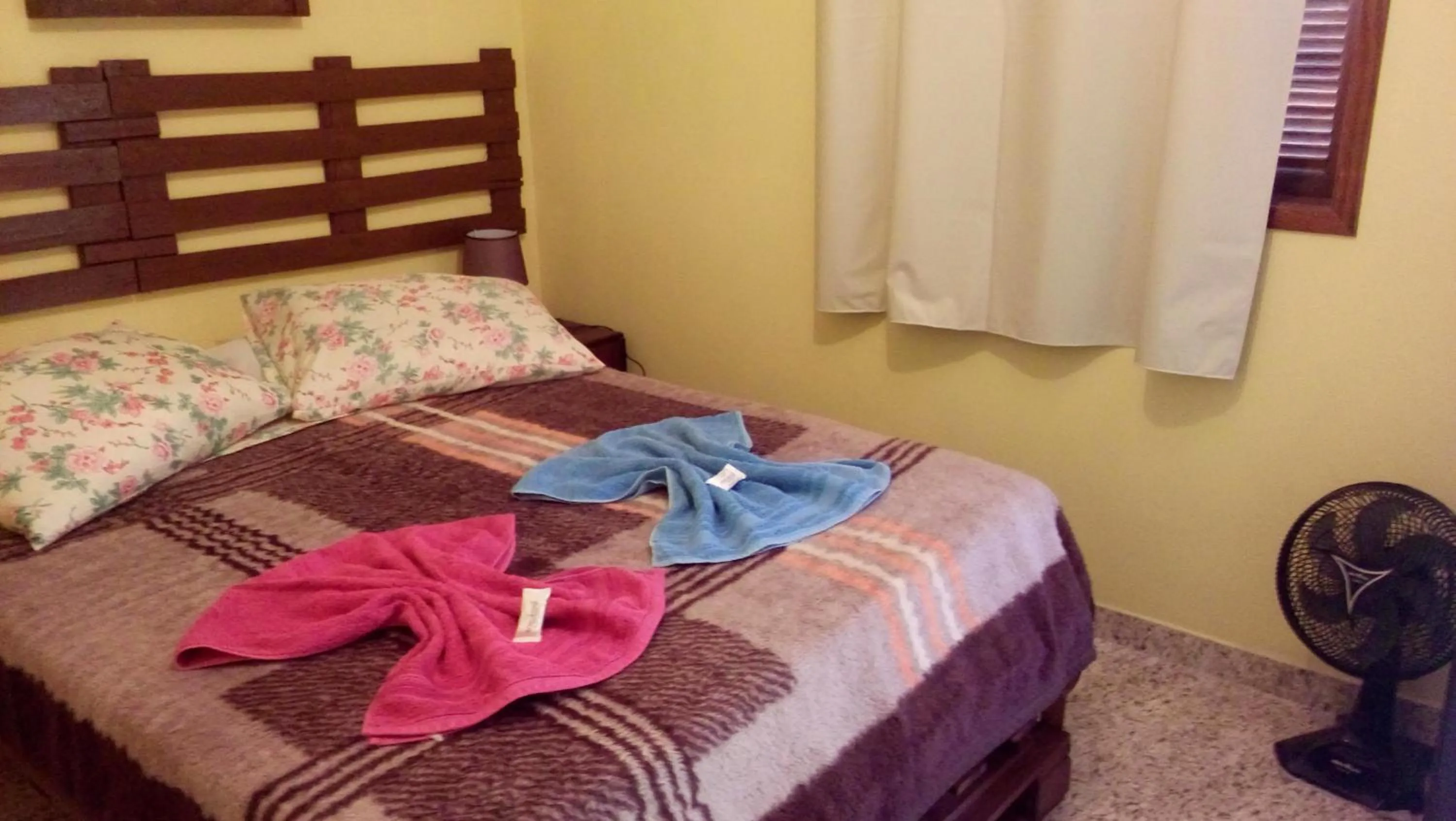 Bed in Sítio e Pousada Recanto Dos Ipês