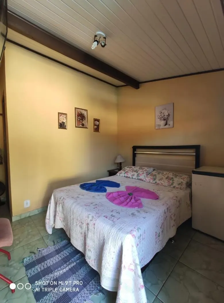 Bed in Sítio e Pousada Recanto Dos Ipês