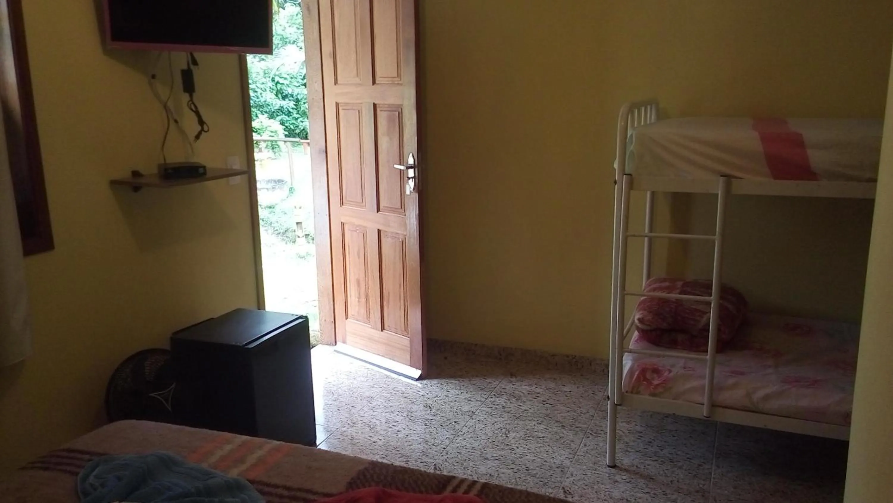 Bed in Sítio e Pousada Recanto Dos Ipês