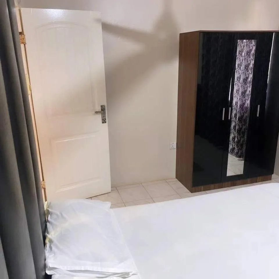 wardrobe, Bed in Harmony house apartments