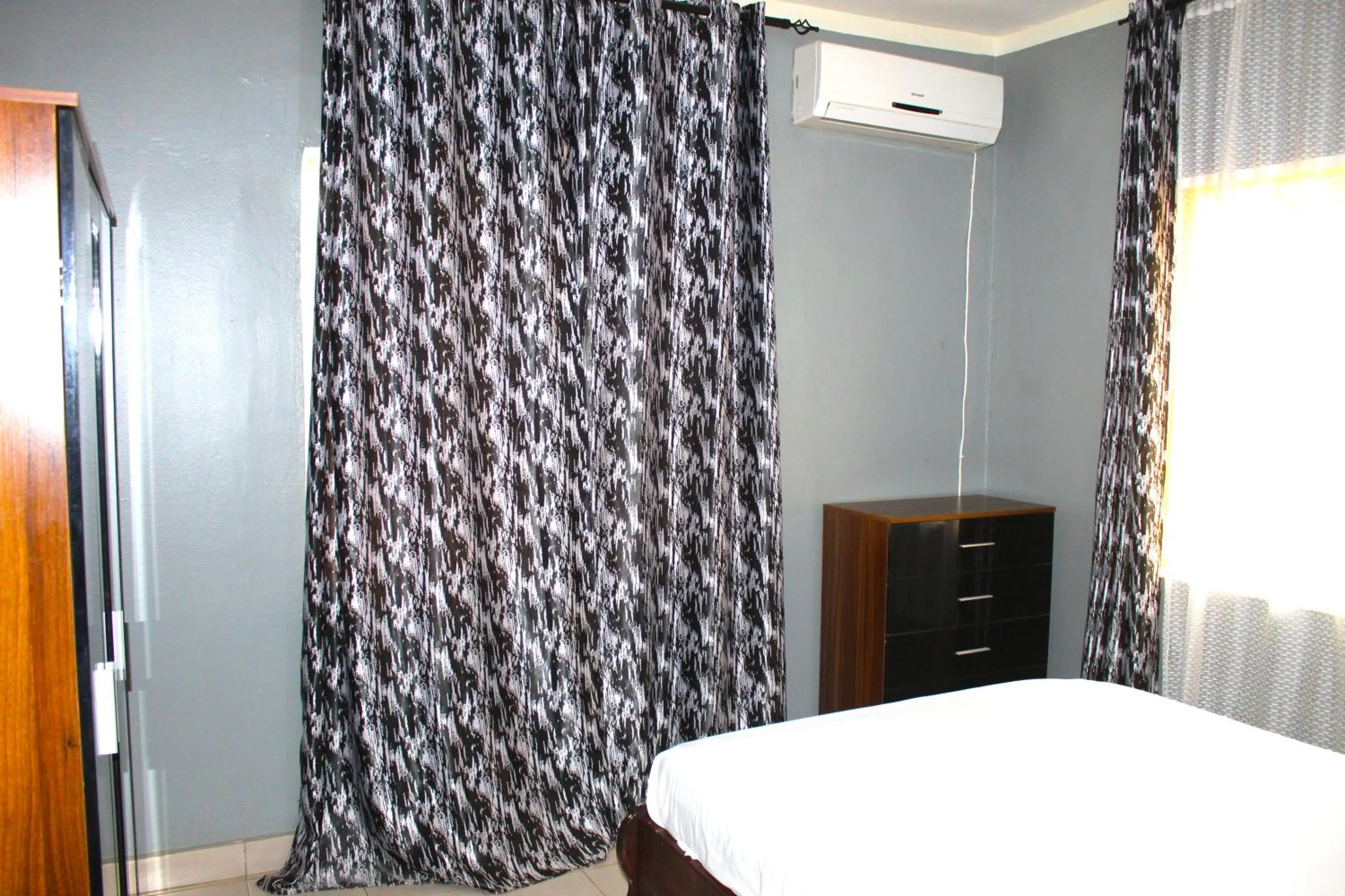 Bedroom, Bed in Harmony house apartments