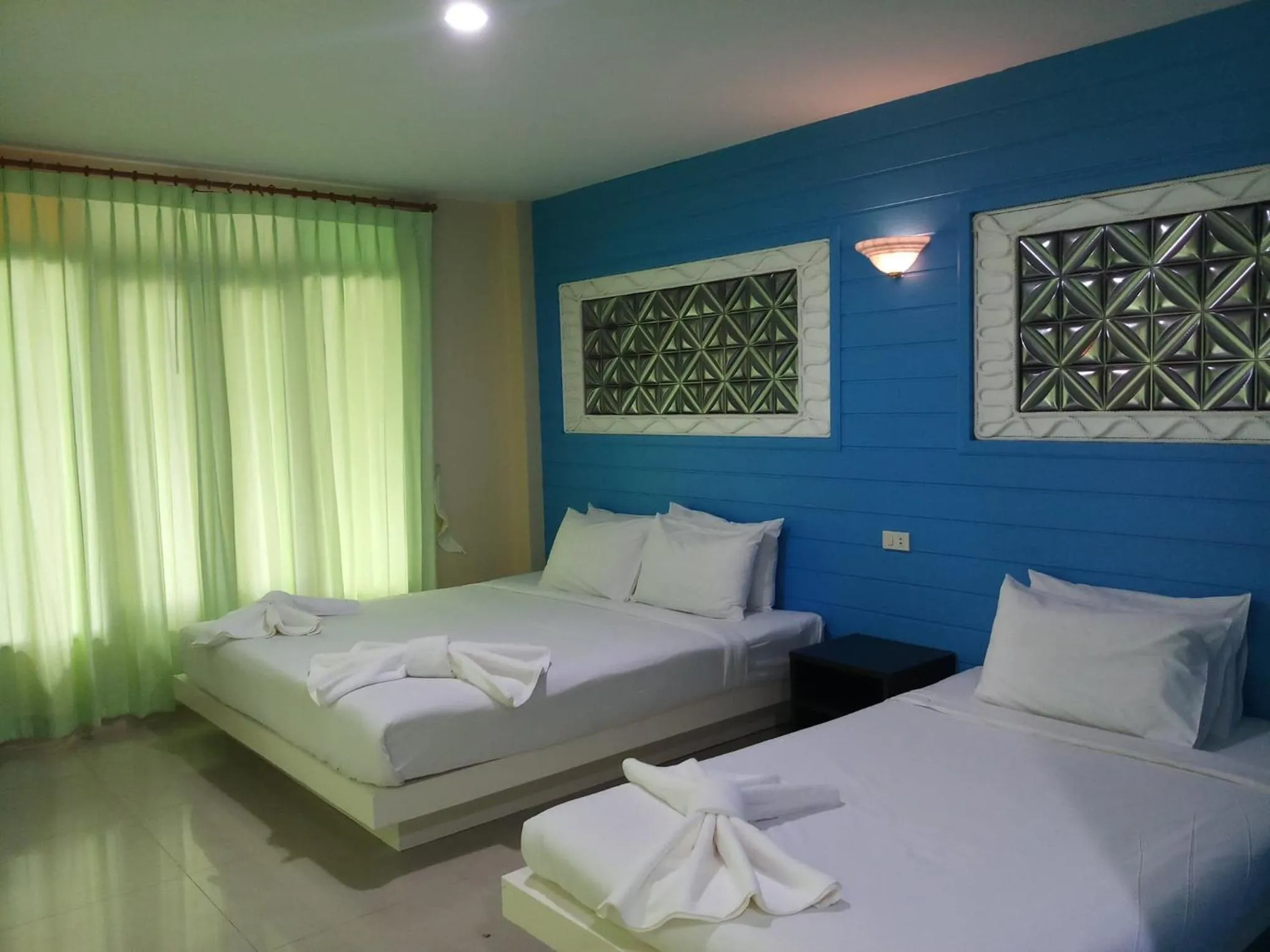 Bed in Baan Talay See Cream Resort