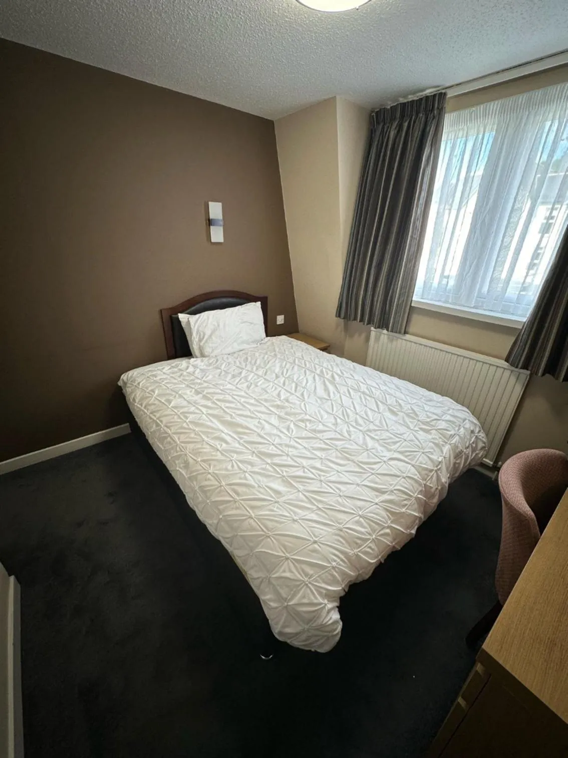 Bed in Burnett Arms Hotel